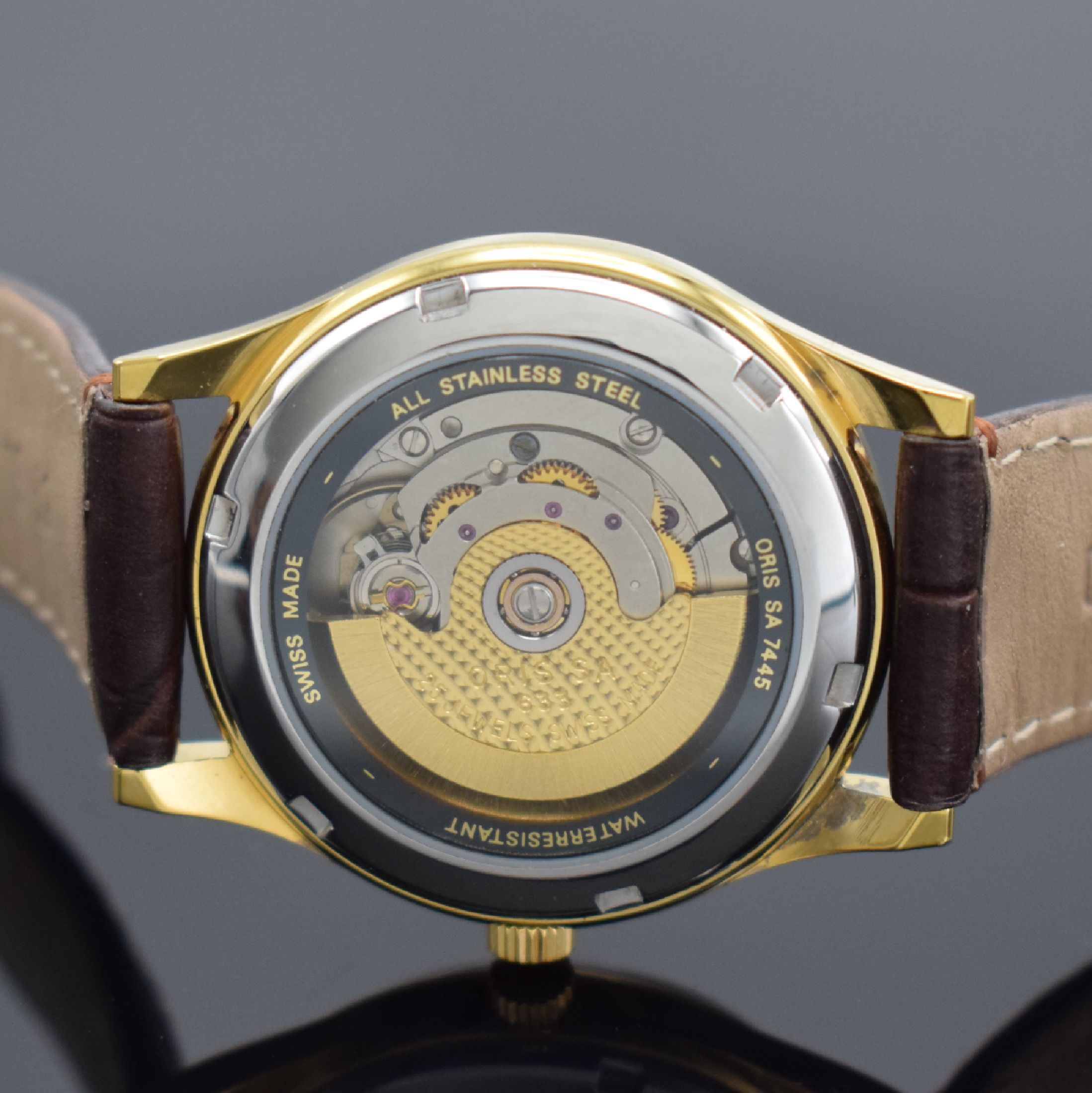 Detail e: ORIS Armbanduhr in Stahl/vergoldet, Schweiz um 1995, Automatik, beids. vergl. Geh., Boden verschr., orig. Lederband m. verg. Stiftschl., silb. ...