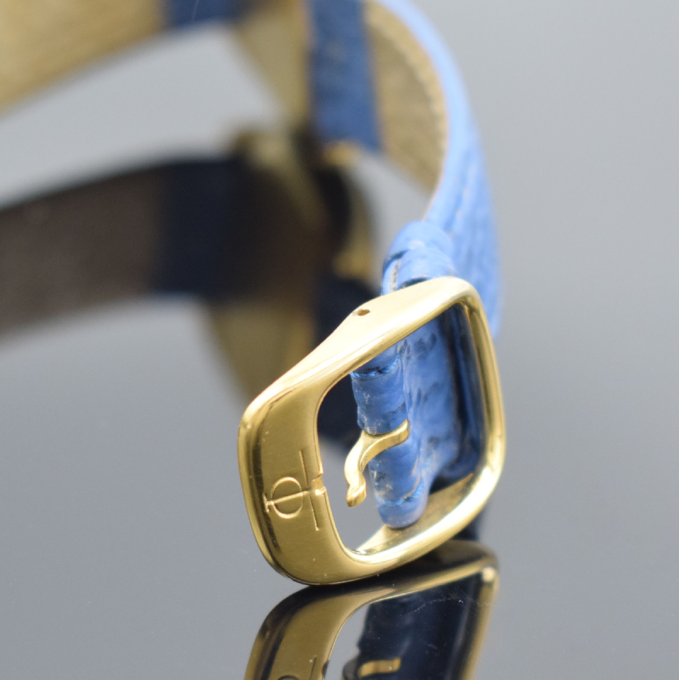 Detail b: BAUME & MERCIER Baumatic 36000 Armbanduhr in GG 750/000, Schweiz um 1975, Automatik, 4- fach verschr. Geh., blaues Zifferbl. m. gold. röm. Zahlen, ...