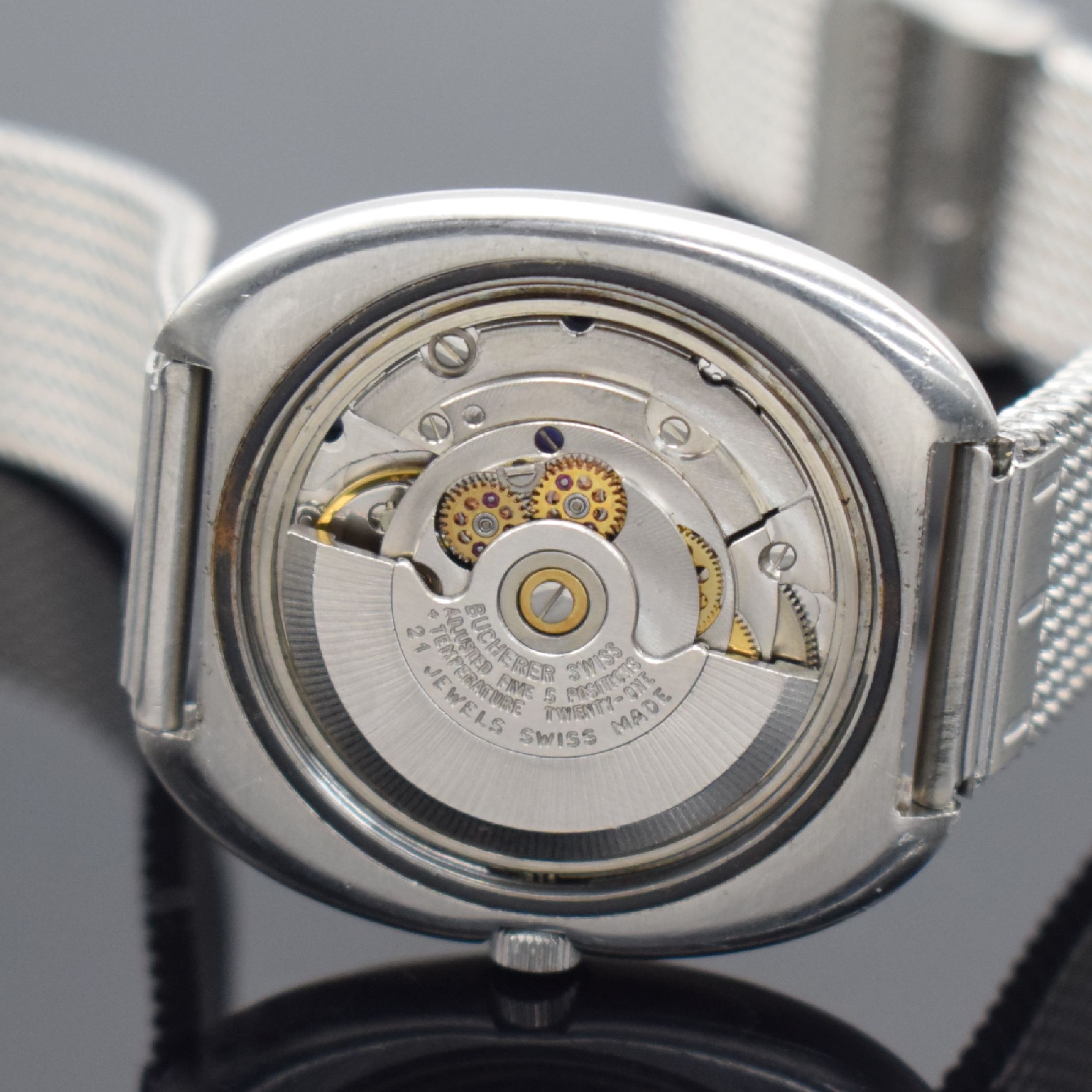 Detail e: BUCHERER Armbandchronometer in Edelstahl, Automatik, Schweiz um 1970, Boden verschr., neutr. Metallband, blaues Zifferbl. altersbed. l. korr., Anz. ...