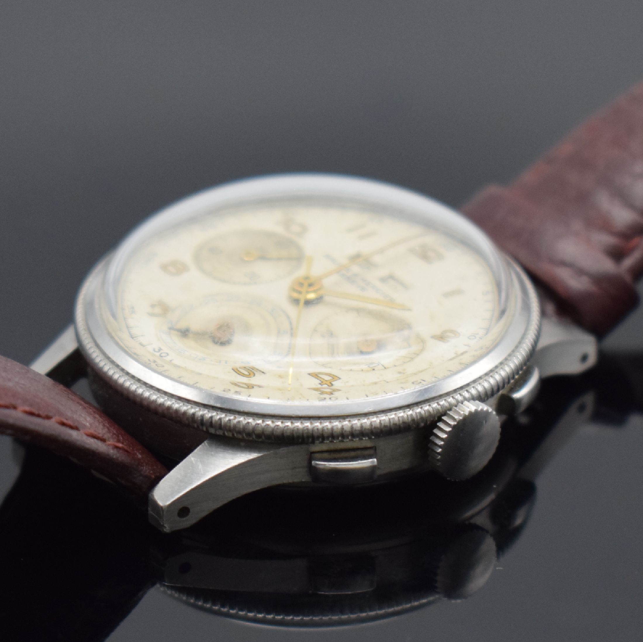 Detail b: BAUME & MERCIER extrem seltener Armbandchronograph in Stahl, Handaufzug, Schweiz 1950er Jahre, Boden aufgedr., silb. Zifferbl. altersbed. fl./pat., ...