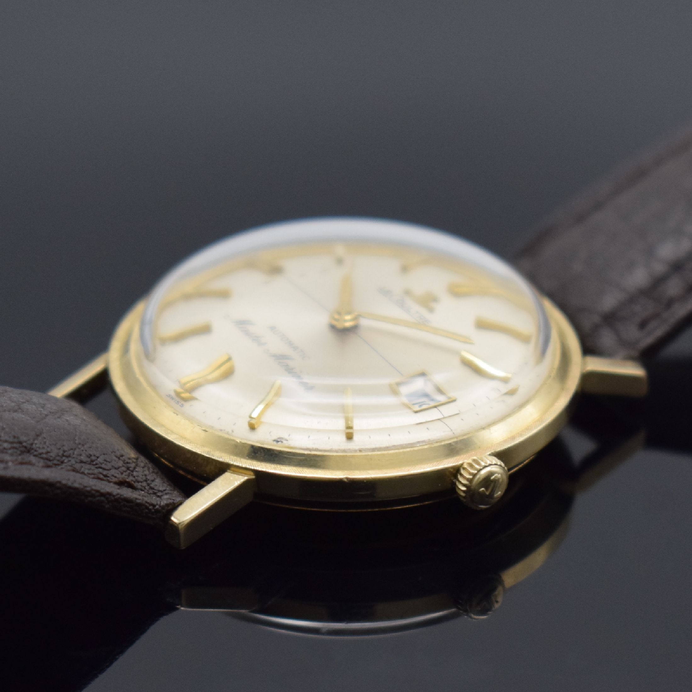 Detail b: LeCoultre Master Mariner Herrenarmbanduhr in GG 585/000, Schweiz/USA um 1960, Automatik, einschaliges Geh. mit grav. Lünette, silb. Zifferbl. m. ...