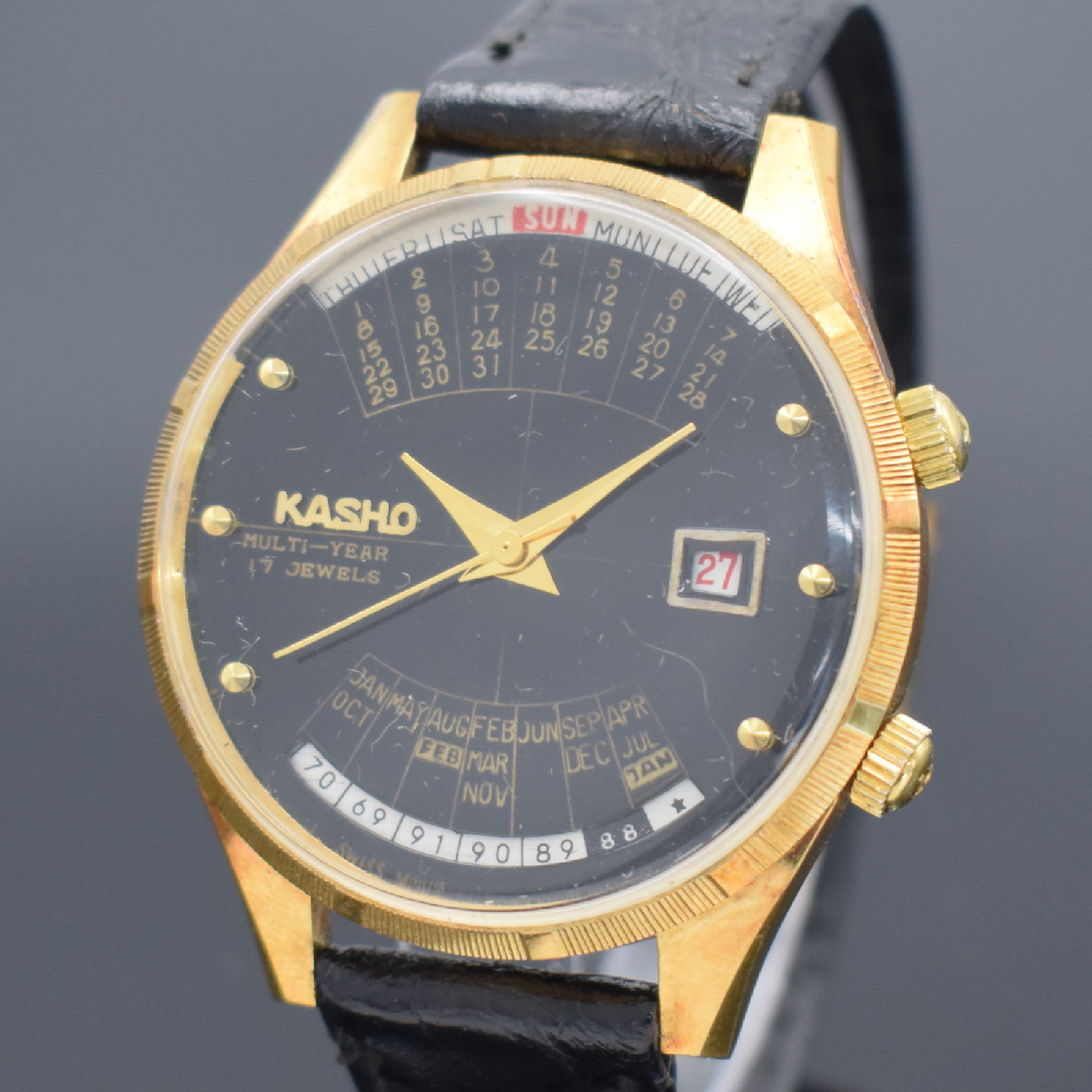 Detail a: KASHO Multi Year vergoldete Herrenarmbanduhr, Schweiz/Hong Kong um 1969, Handaufzug, verg. Geh. teils angel., Edelstahlboden gedr., geriffelte ...