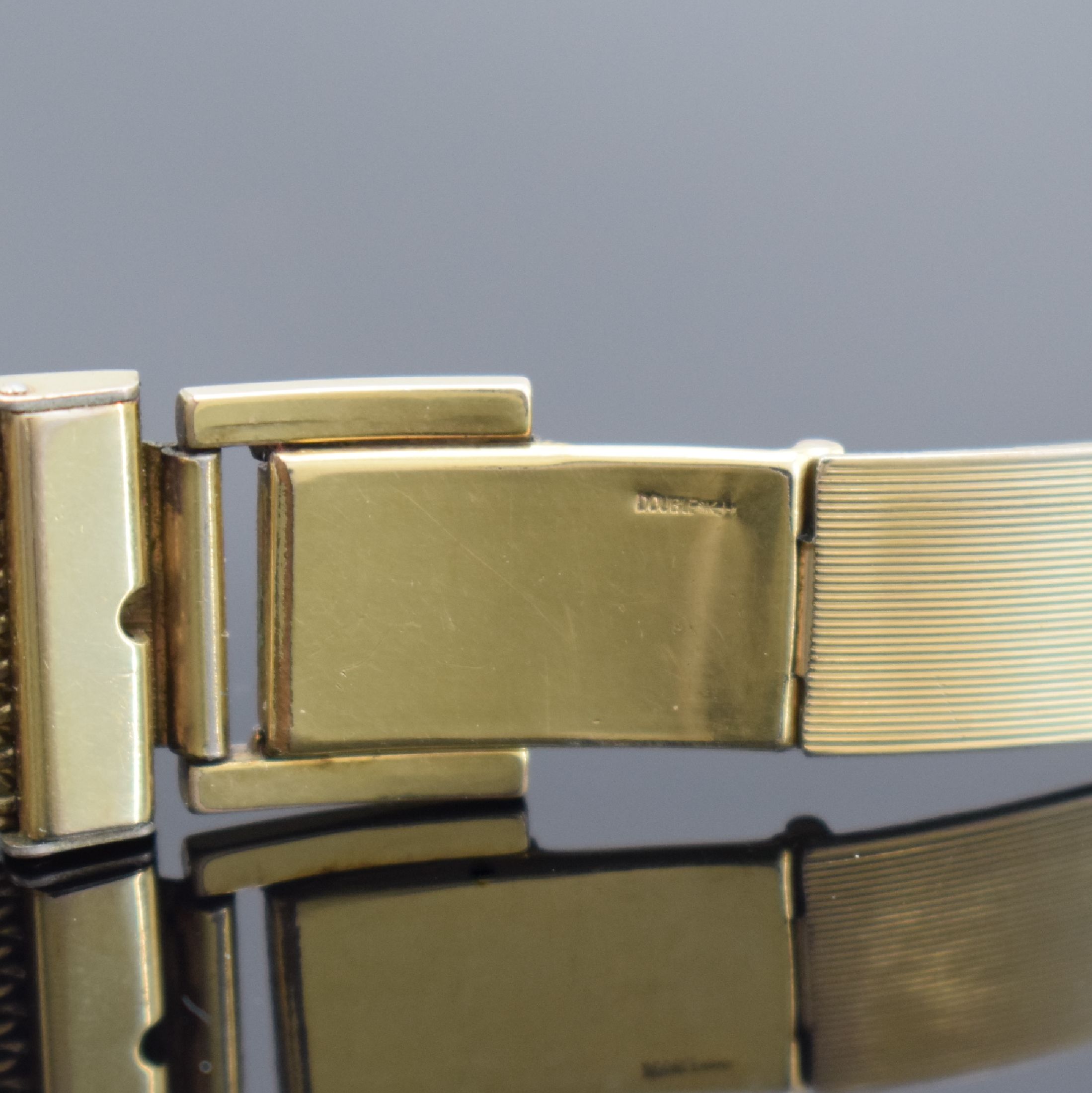 Detail b: ORFINA vergoldete Armbanduhr, Schweiz 1950er Jahre, Handaufzug, Stahlboden gedr., neutr. Double-Band, silb. Zifferbl. fl., gold. Ind. & arab. Zahlen, ...