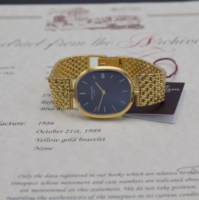 Image PATEK PHILIPPE 18k yellow gold wristwatch Ellipse reference 3930/1, quartz, two-piece construction case including bracelet, blue "Sigma" dial with raised gold-indices, display of hours, minutes & date, measures approx. 34 x 29 mm, length approx. 18,5 cm, PPC extract of the archives from November 2021 enclosed, condition 2