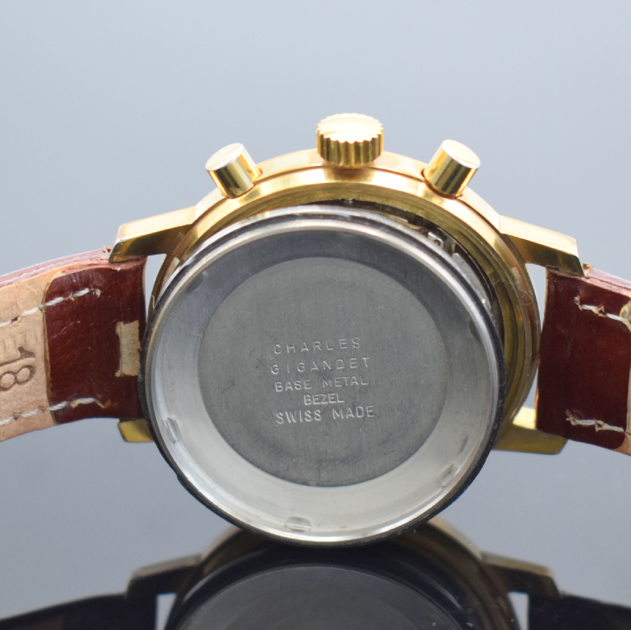 Detail e: WAKMANN Schaltradchronograph, Handaufzug, Schweiz 1967, verg. Metallgeh., verschr. Edelstahlboden & Werk bez. Charles Gigandet, gold. Zifferblatt m. ...