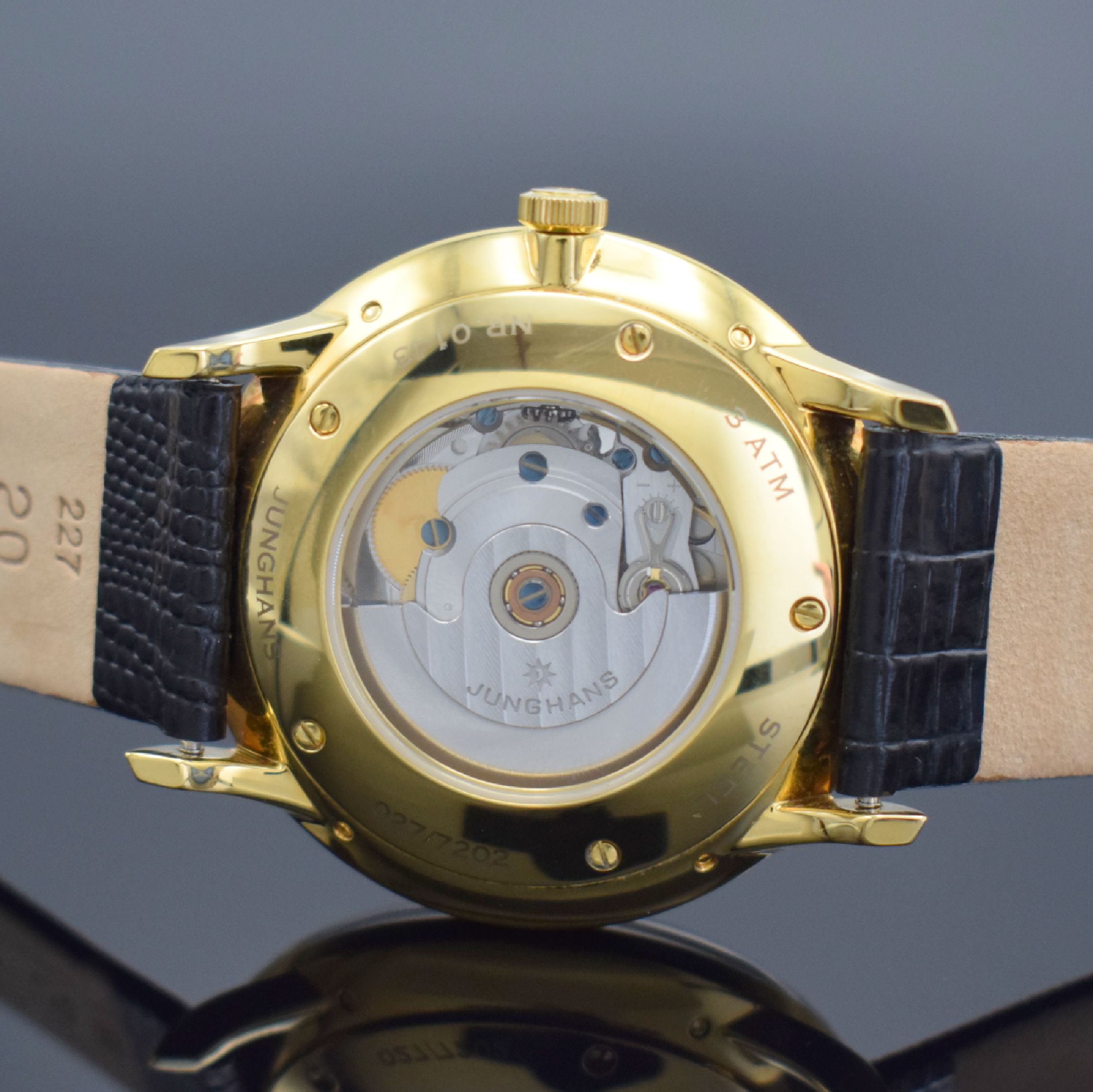 Detail d: JUNGHANS Meister Kalender Herrenarmbanduhr Referenz 027/7202.00, Automatik, verg. Edelstahlgeh. beids. verglast, Boden 5-fach verschr., vers. ...