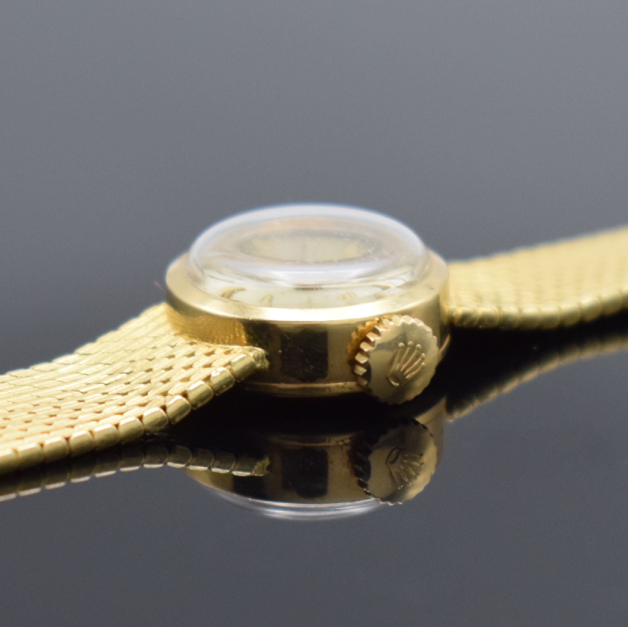 Detail c: ROLEX Damengoldbanduhr in GG 750/000, Schweiz um 1950, Handaufzug, Geh. an neutr. Goldband in GG 750/000, Boden aufgedr., silb. Zifferbl. m. gold. ...