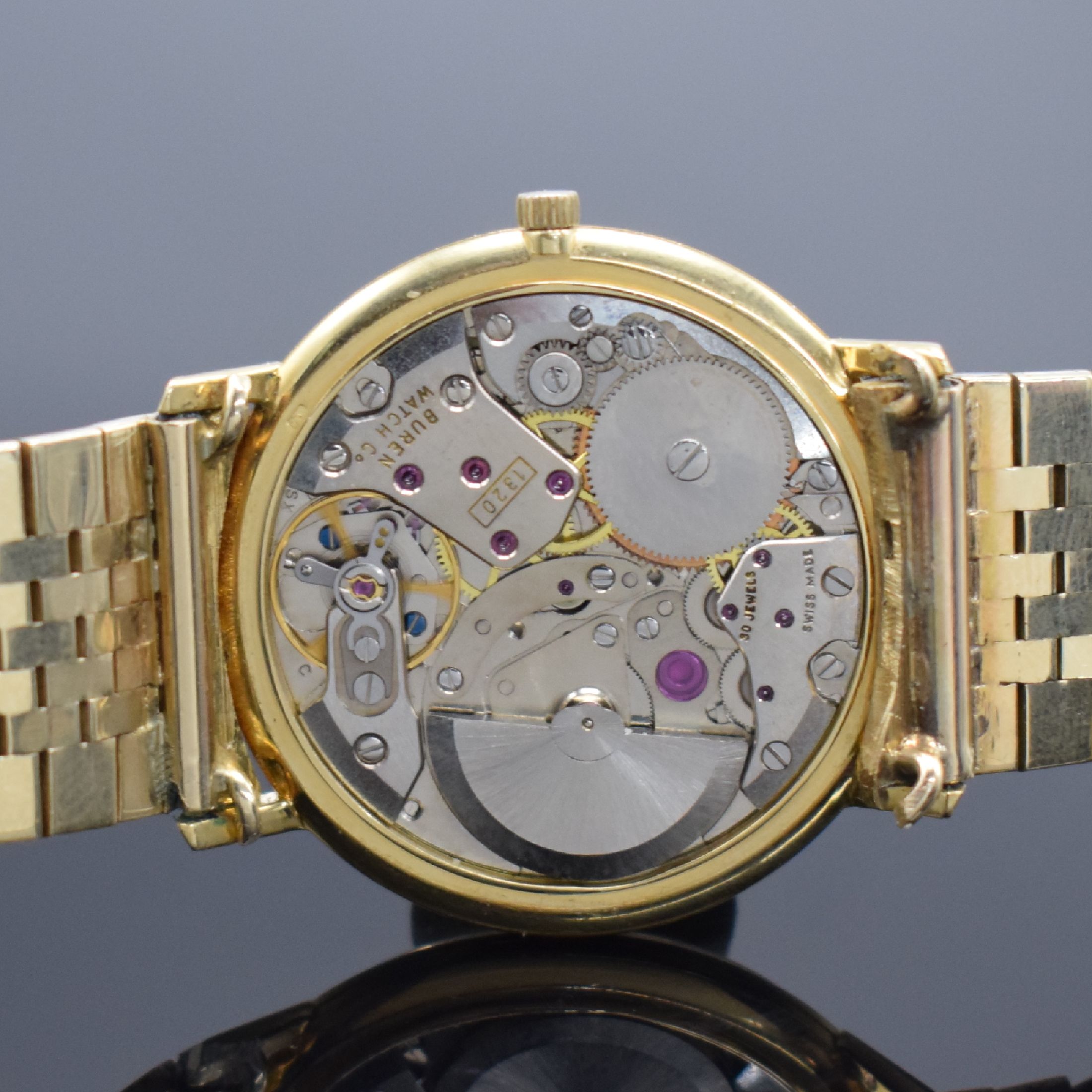 Detail d: DUGENA Herrenarmbanduhr Modell Super in GG 750/000, Schweiz um 1965, Automatik m. Microrotor, Boden aufgedr., neutr. GG 585/000 Band, silb. Zifferbl. ...