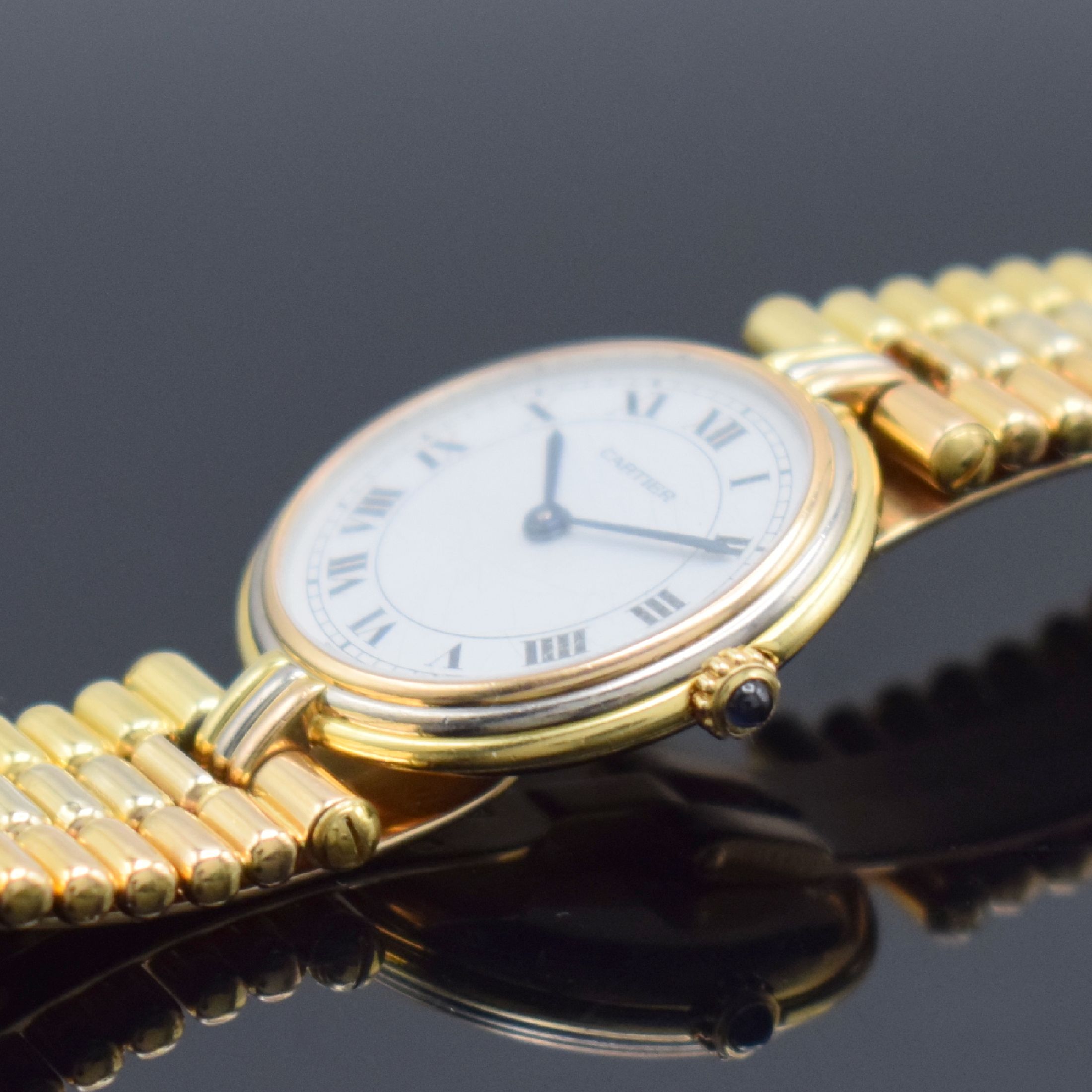 Detail c: CARTIER Vendome Trinity Damengoldbanduhr in GG/WG/RG 750/000, Schweiz um 1990, quarz, 2 -fach verschr. Geh., Lünette & Anstöße 3 farbig & 3-fach ...