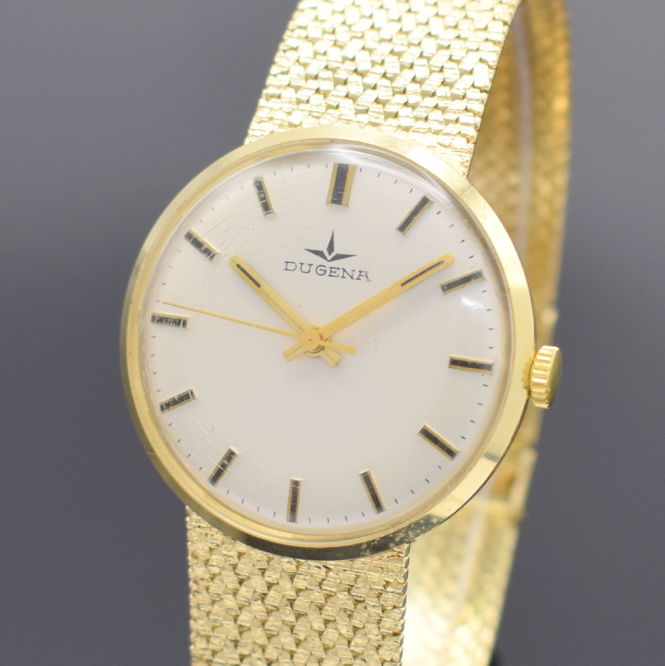 Detail a: DUGENA Herrengoldbanduhr in GG 585/000, Schweiz um 1960, Handaufzug, Geh. an neutr. Goldband in GG 585/000, Boden & Glasrand aufgedr., silb. ...