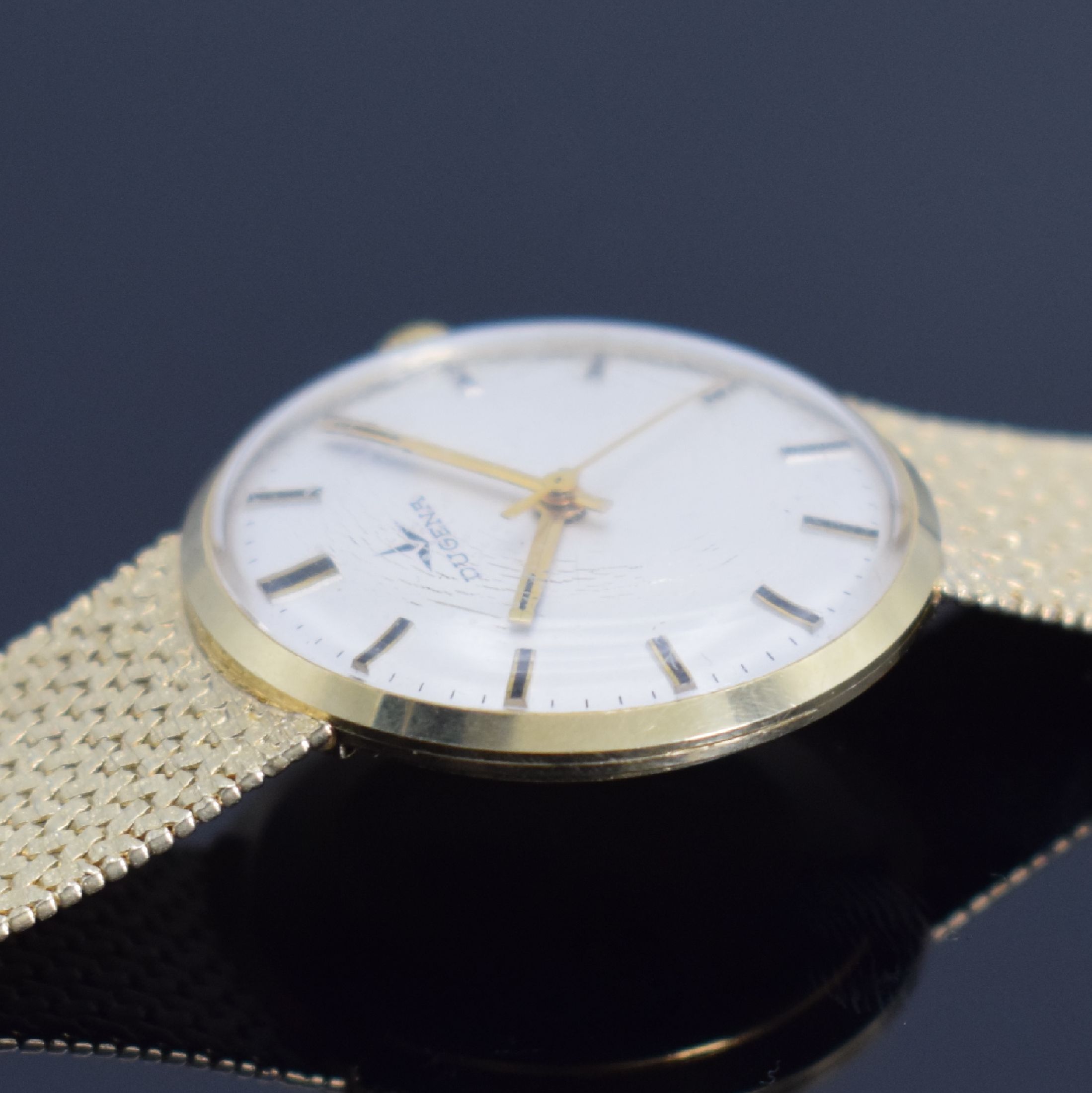 Detail c: DUGENA Herrengoldbanduhr in GG 585/000, Schweiz um 1960, Handaufzug, Geh. an neutr. Goldband in GG 585/000, Boden & Glasrand aufgedr., silb. ...