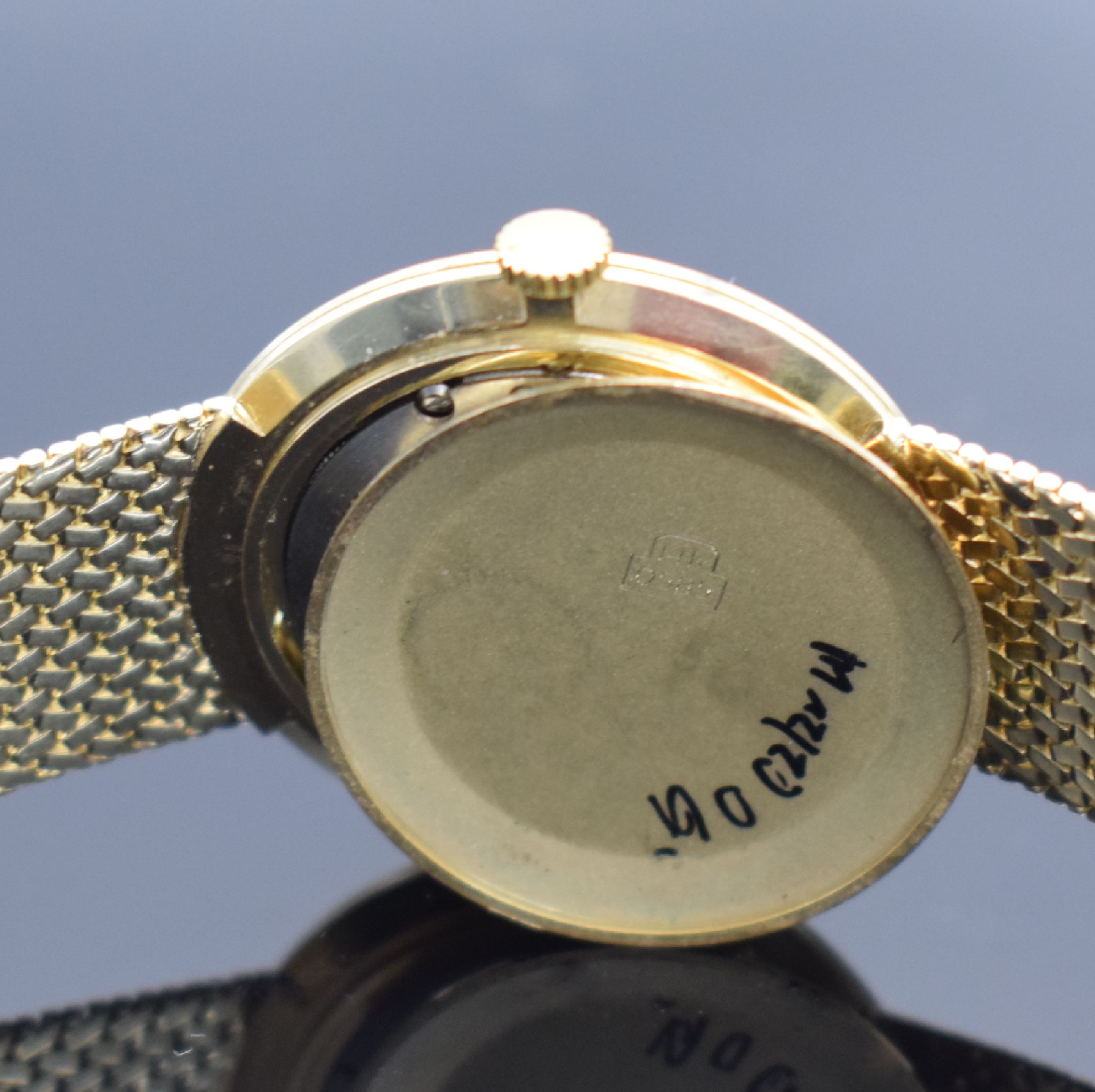Detail f: DUGENA Herrengoldbanduhr in GG 585/000, Schweiz um 1960, Handaufzug, Geh. an neutr. Goldband in GG 585/000, Boden & Glasrand aufgedr., silb. ...