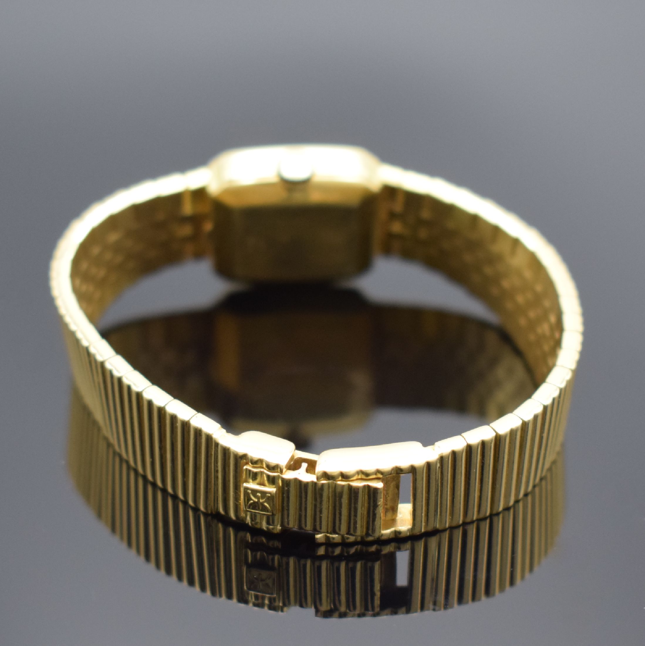 Detail b: EBEL Damengoldbanduhr in GG 750/000, Schweiz verk. lt. beil. orig. Garantie 08/1982, Handaufzug, Geh. an orig. Goldband in GG 750/000, dell. Boden ...