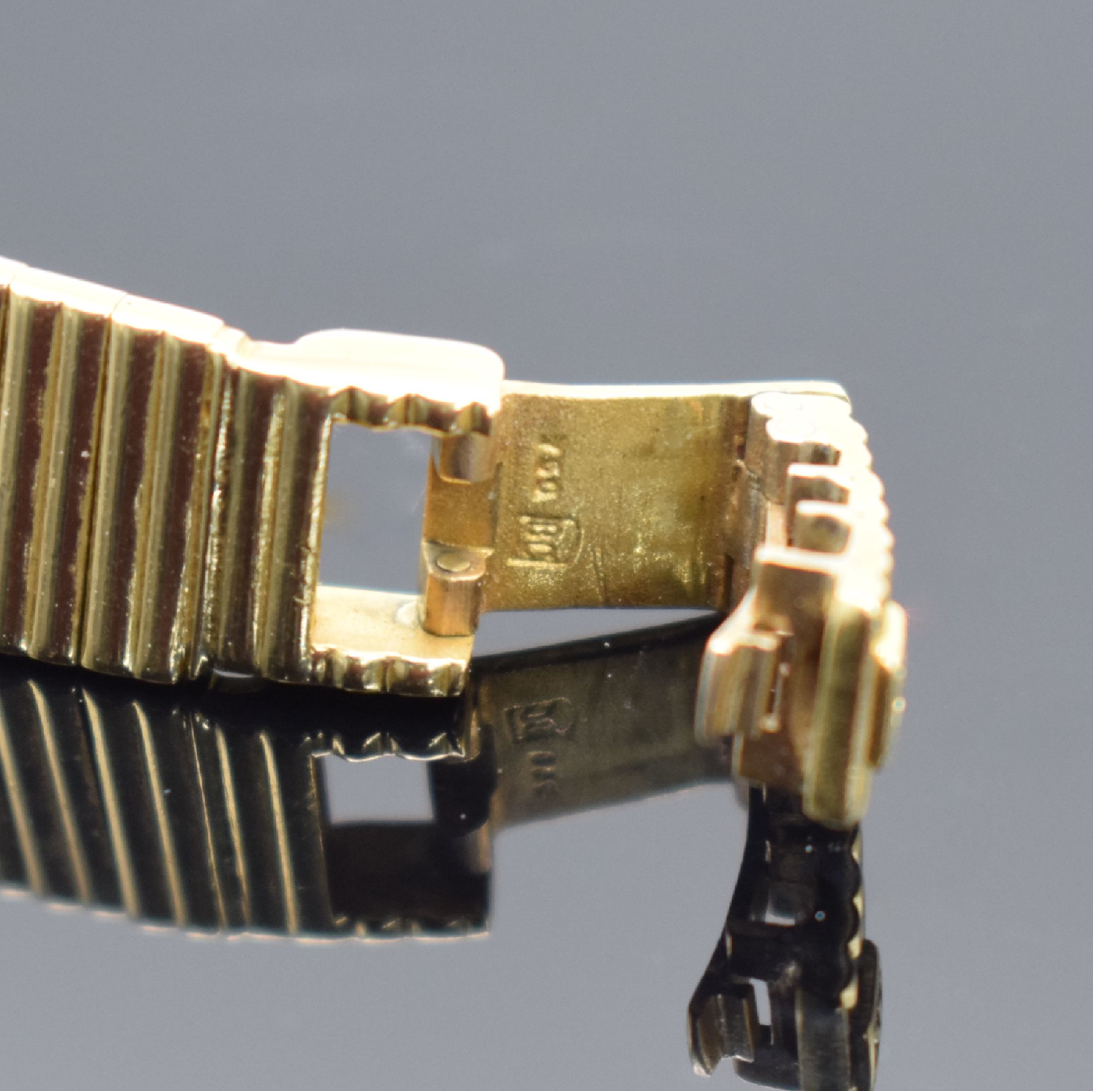 Detail c: EBEL Damengoldbanduhr in GG 750/000, Schweiz verk. lt. beil. orig. Garantie 08/1982, Handaufzug, Geh. an orig. Goldband in GG 750/000, dell. Boden ...