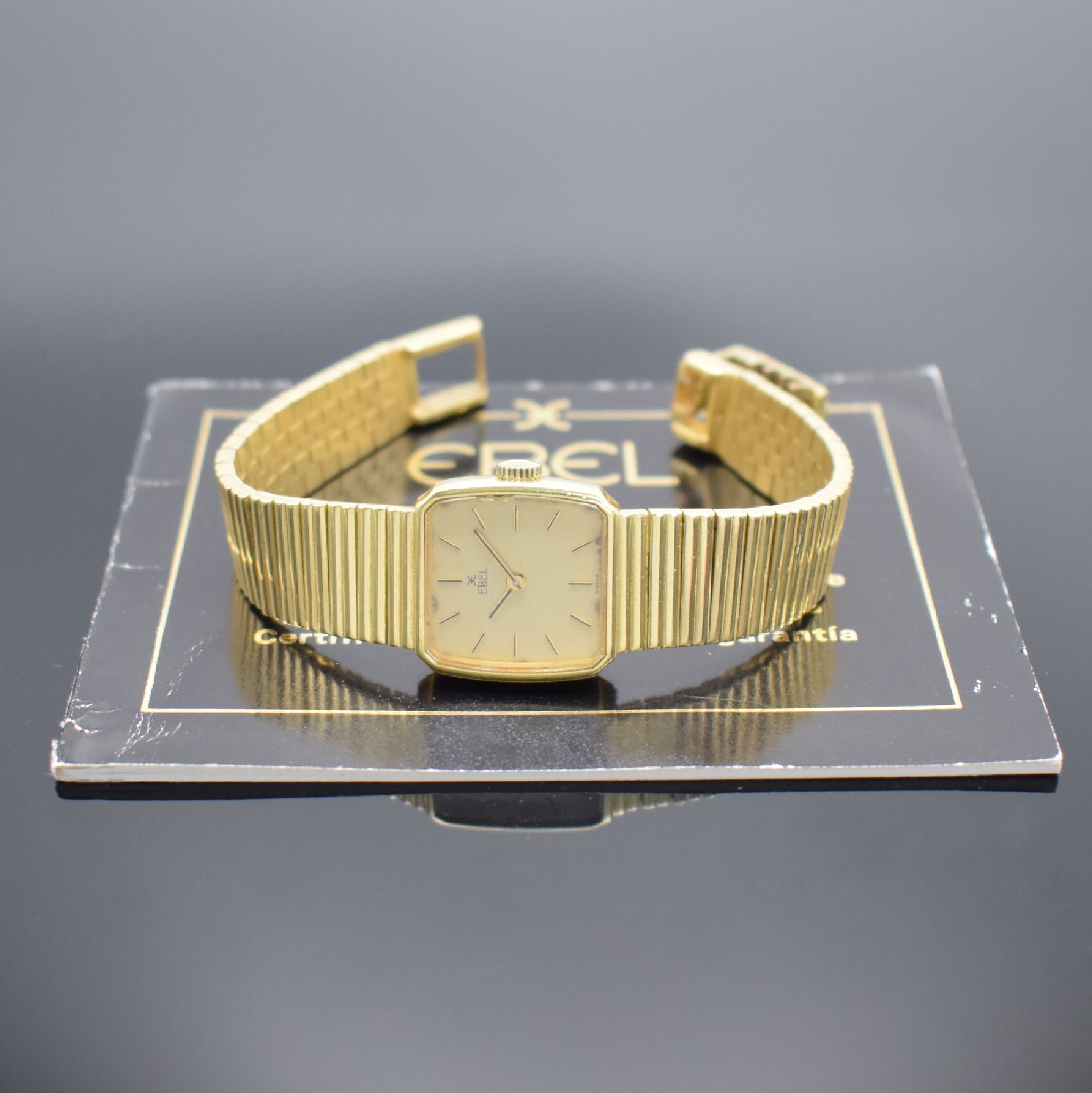 Detail h: EBEL Damengoldbanduhr in GG 750/000, Schweiz verk. lt. beil. orig. Garantie 08/1982, Handaufzug, Geh. an orig. Goldband in GG 750/000, dell. Boden ...