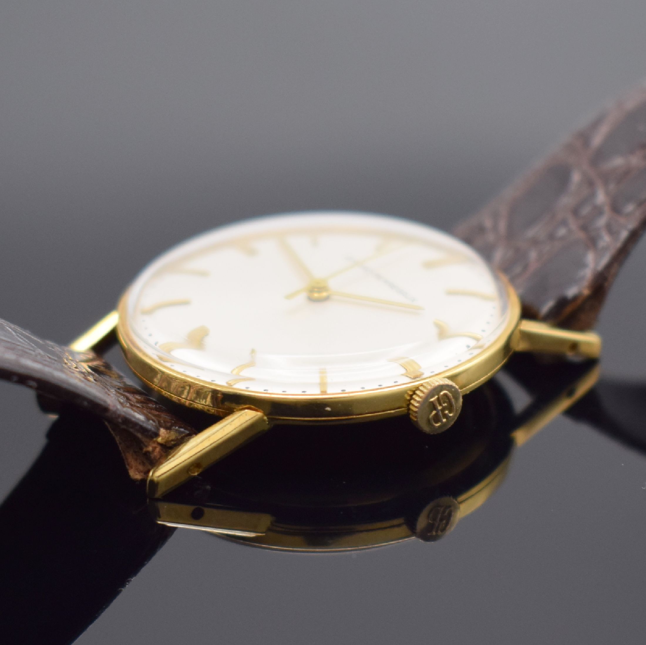 Detail b: GIRARD PERREGAUX Herrenarmbanduhr in GG 750/000, Schweiz um 1965, Handaufzug, Boden aufgedr., silb. Zifferbl. m. gold. Std.-Ind. & Zeigern rest., ...