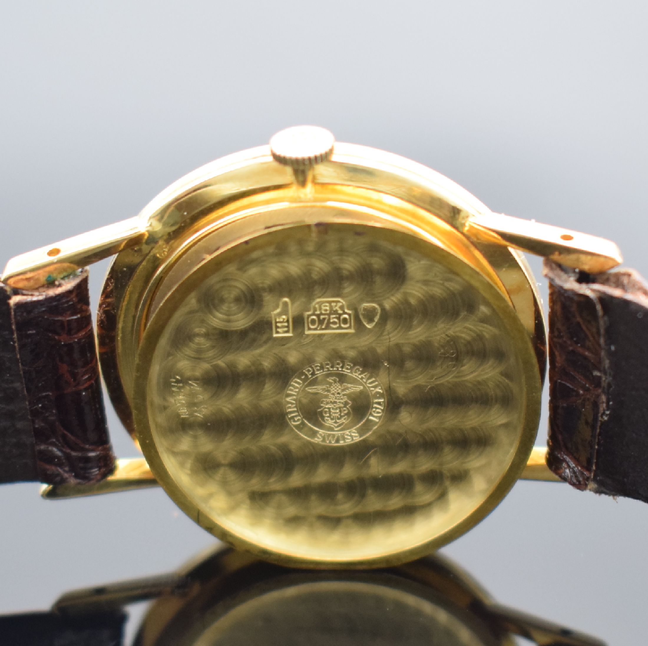 Detail f: GIRARD PERREGAUX Herrenarmbanduhr in GG 750/000, Schweiz um 1965, Handaufzug, Boden aufgedr., silb. Zifferbl. m. gold. Std.-Ind. & Zeigern rest., ...
