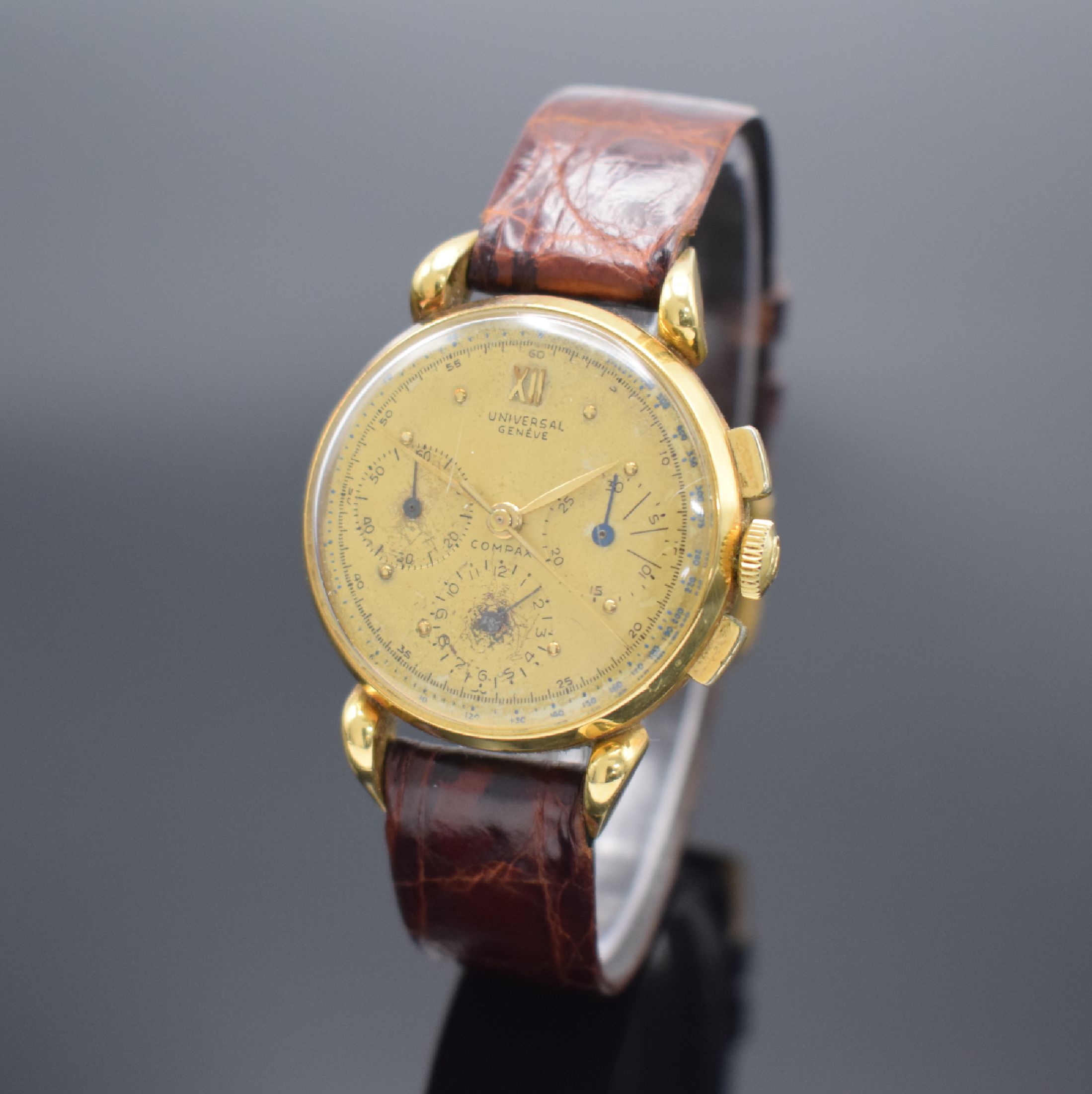 UNIVERSAL GENEVE Compax Schaltradchronograph in GG 750/000, Schweiz um 1945, Handaufzug, dell. Geh. teils angel., Boden & Glasrand aufgedr., ...