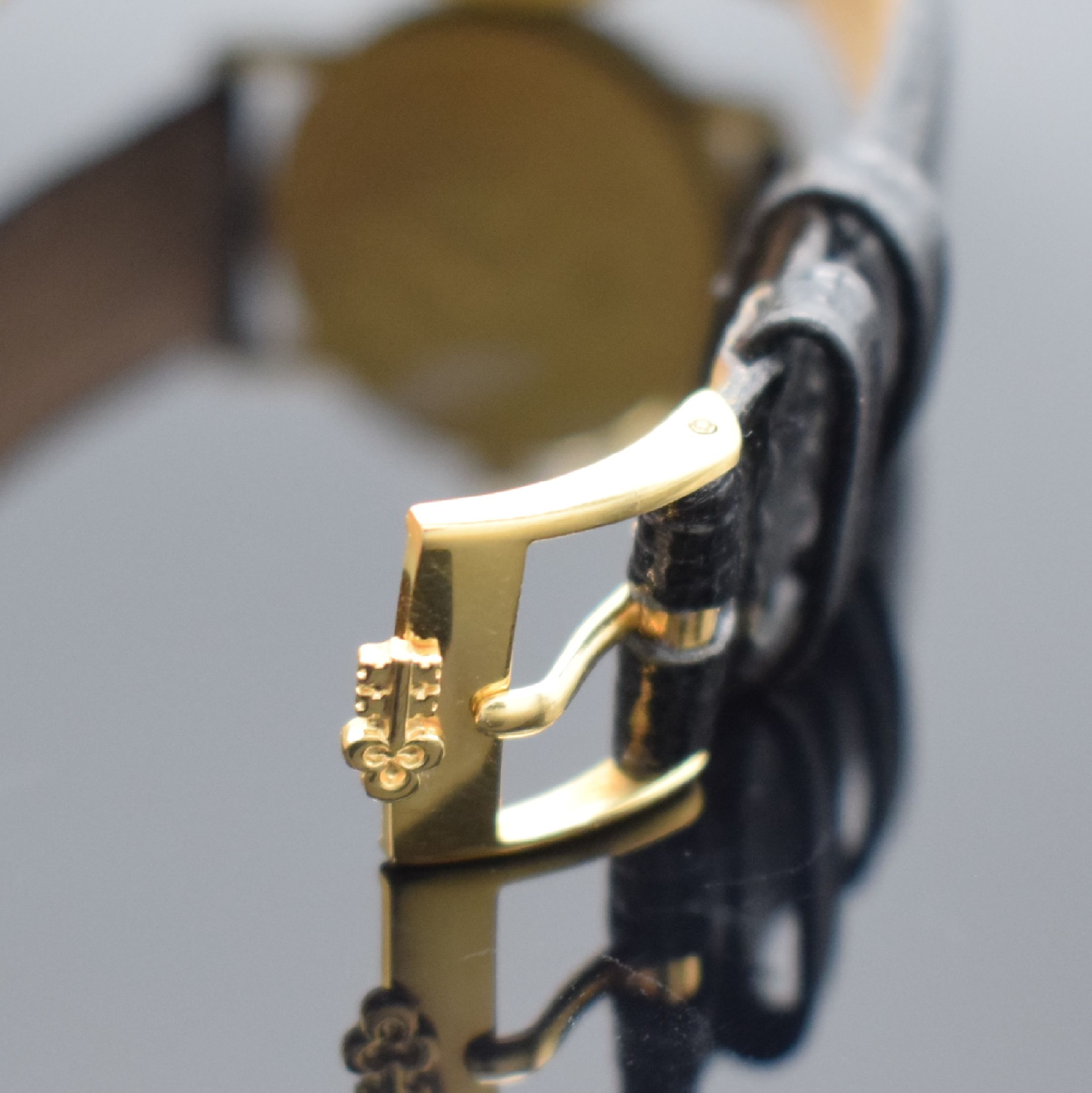 Detail b: CORUM Herrenarmbanduhr in Form einer 10 US- Dollar Goldmünze von 1884, Handaufzug, Schweiz um 1976, massiv GG 750/000 inkl. Lederband m. orig. ...