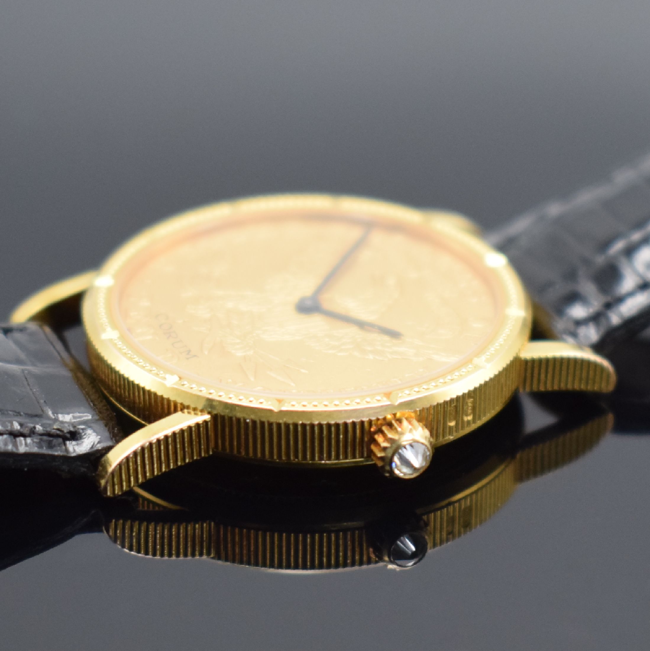Detail c: CORUM Herrenarmbanduhr in Form einer 10 US- Dollar Goldmünze von 1884, Handaufzug, Schweiz um 1976, massiv GG 750/000 inkl. Lederband m. orig. ...