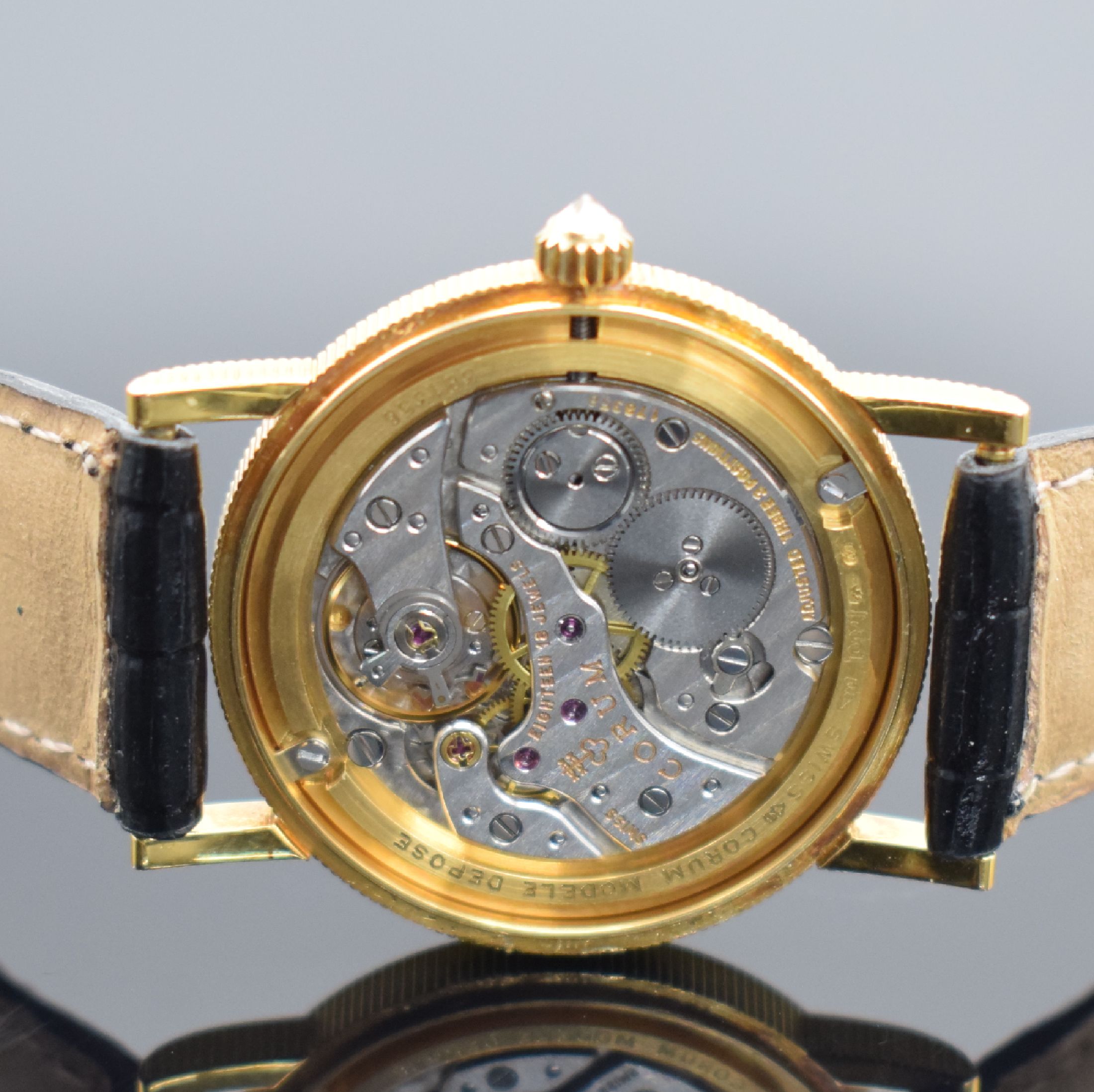 Detail e: CORUM Herrenarmbanduhr in Form einer 10 US- Dollar Goldmünze von 1884, Handaufzug, Schweiz um 1976, massiv GG 750/000 inkl. Lederband m. orig. ...