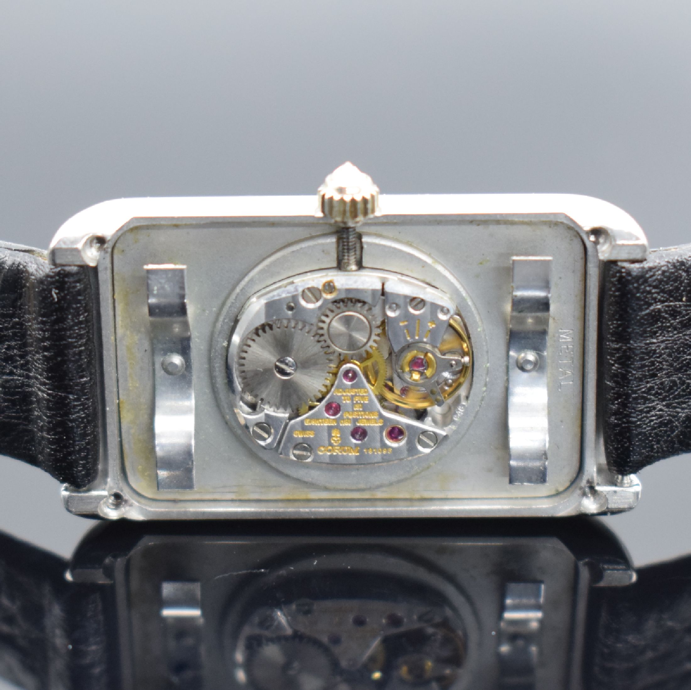 Detail e: CORUM hochfeine & seltene Herrenarmbanduhr in Form eines 10g Platinbarrens Nr. 142, Handaufzug, Schweiz um 1979, Platingeh. inkl. Lederband m. orig. ...