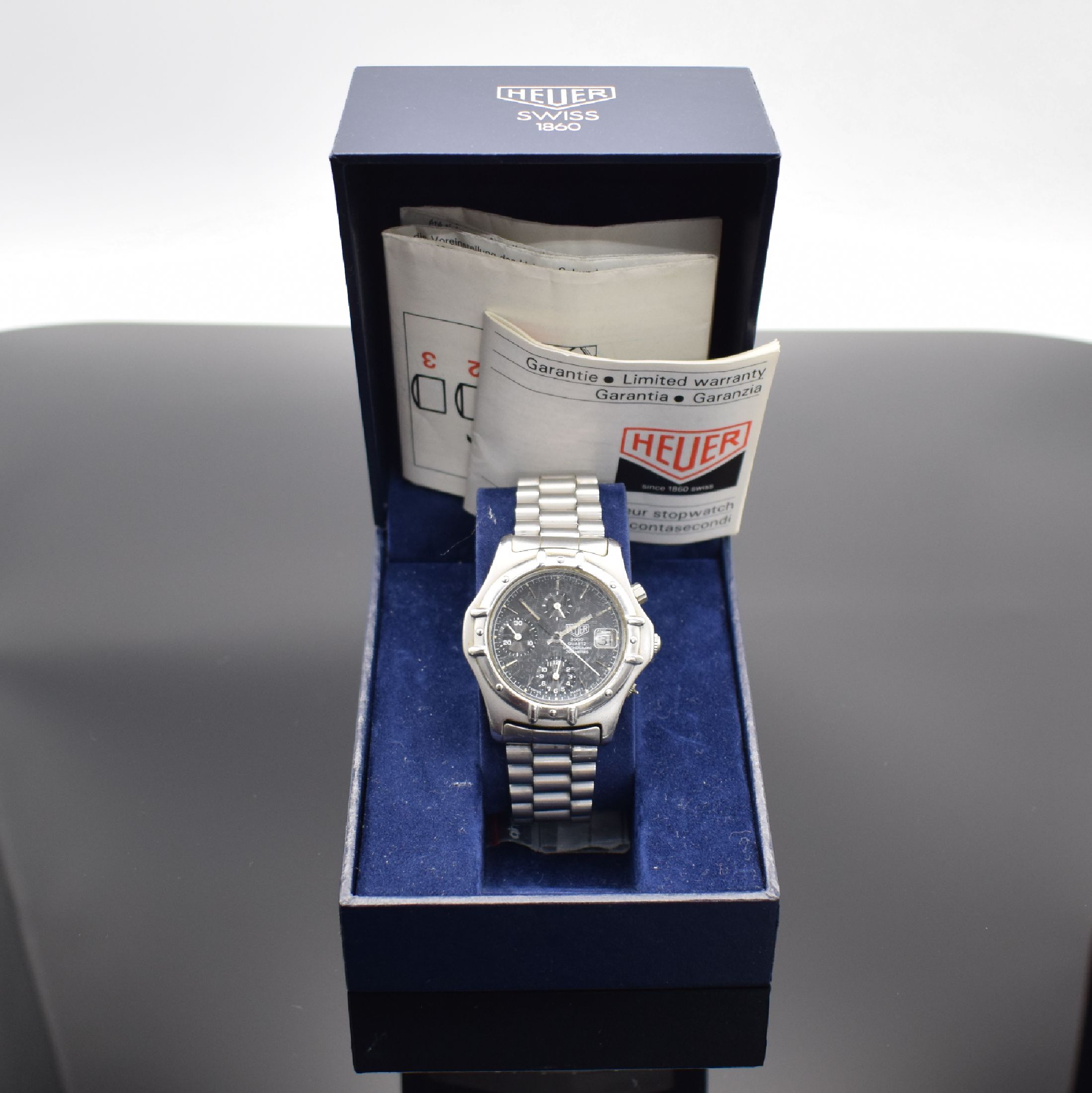 Detail e: HEUER 2000 Herrenarmbanduhr mit Chronograph, Schweiz um 1985, quarz, Ref. 250.006-1, verschr. Edelstahlgeh., orig. Gliederband, Faltschl. m. ...