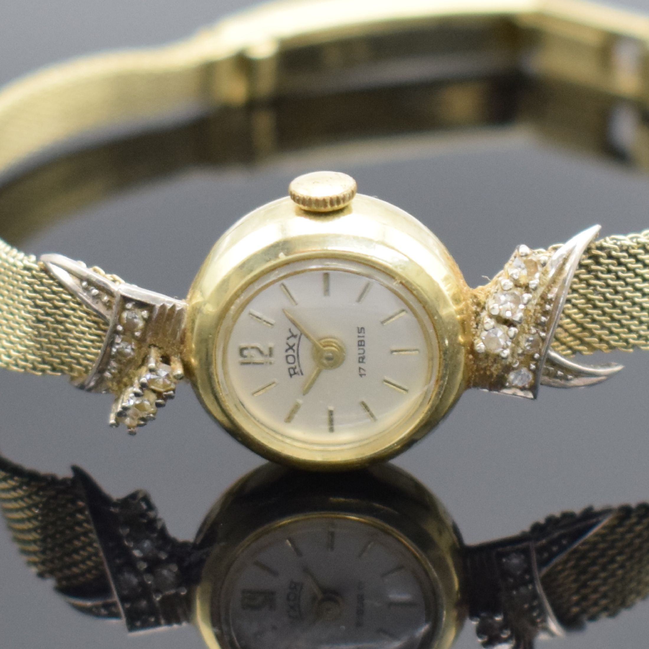 Detail a: ROXY Damenarmbanduhr in GG 585/000 mit Diamanten, Schweiz um 1965, Handaufzug, Geh. an Goldband in GG 585/000, Boden aufgedr., silb. Zifferbl. m. ...