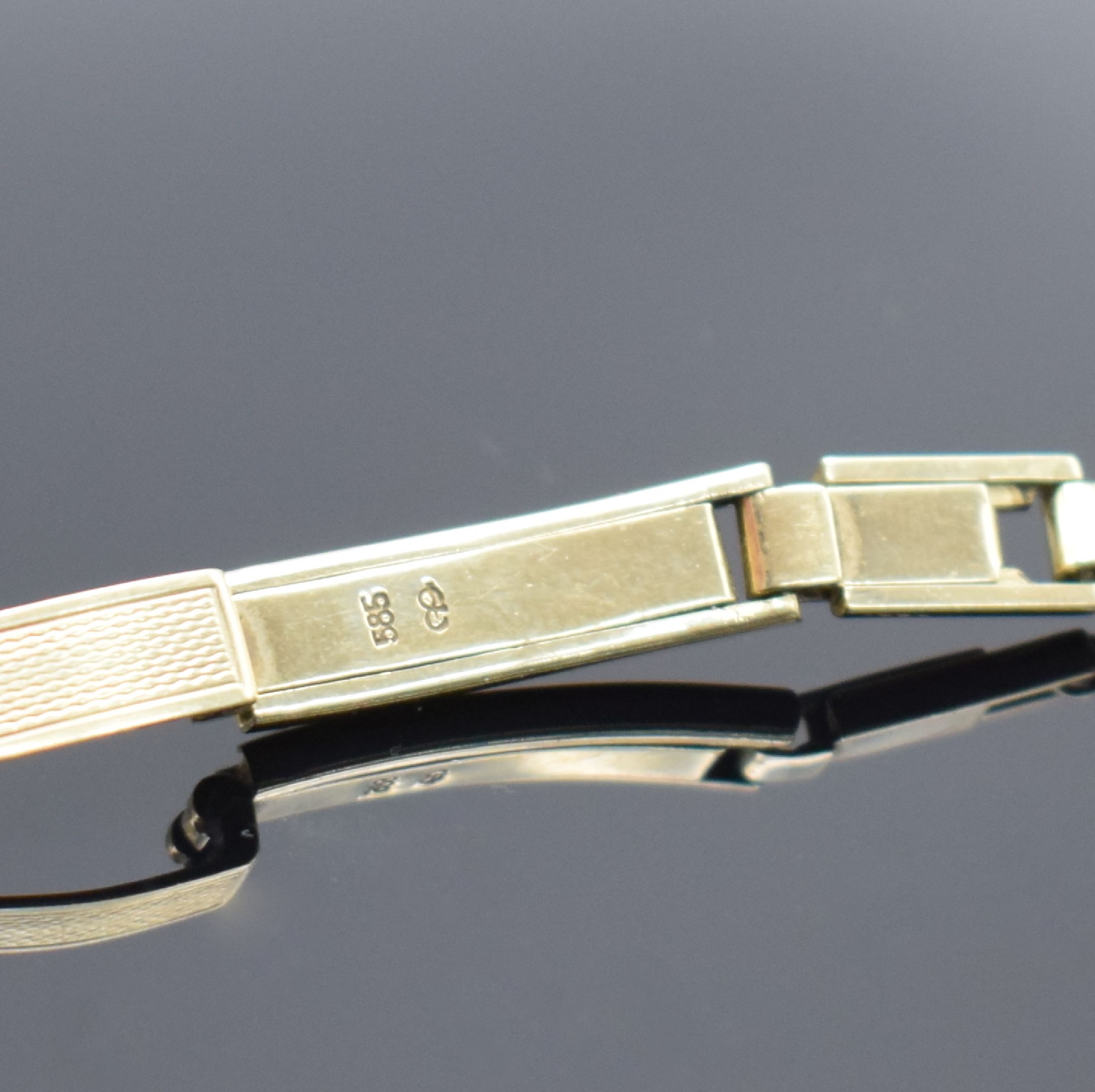 Detail c: ROXY Damenarmbanduhr in GG 585/000 mit Diamanten, Schweiz um 1965, Handaufzug, Geh. an Goldband in GG 585/000, Boden aufgedr., silb. Zifferbl. m. ...