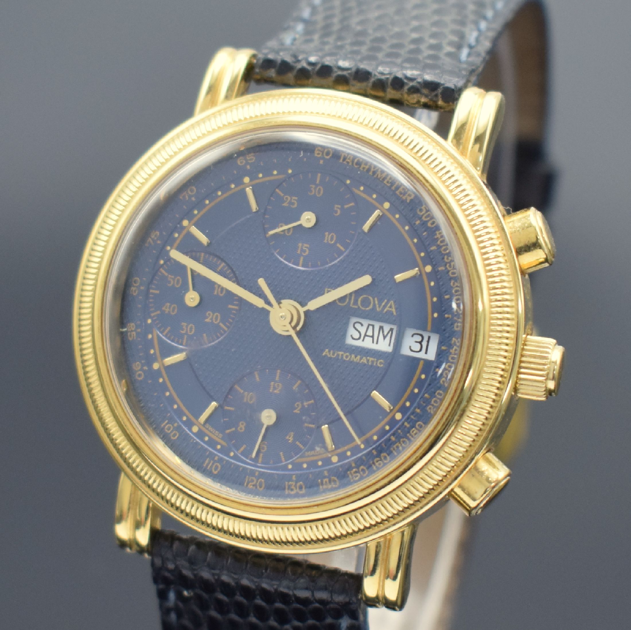 Detail a: BULOVA Herrenarmbanduhr mit Chronograph, Schweiz um 1990, Automatik, 2-teil. verg. Geh., vergl. Boden aufgedr., dunkelblaues Zifferbl., gold. ...