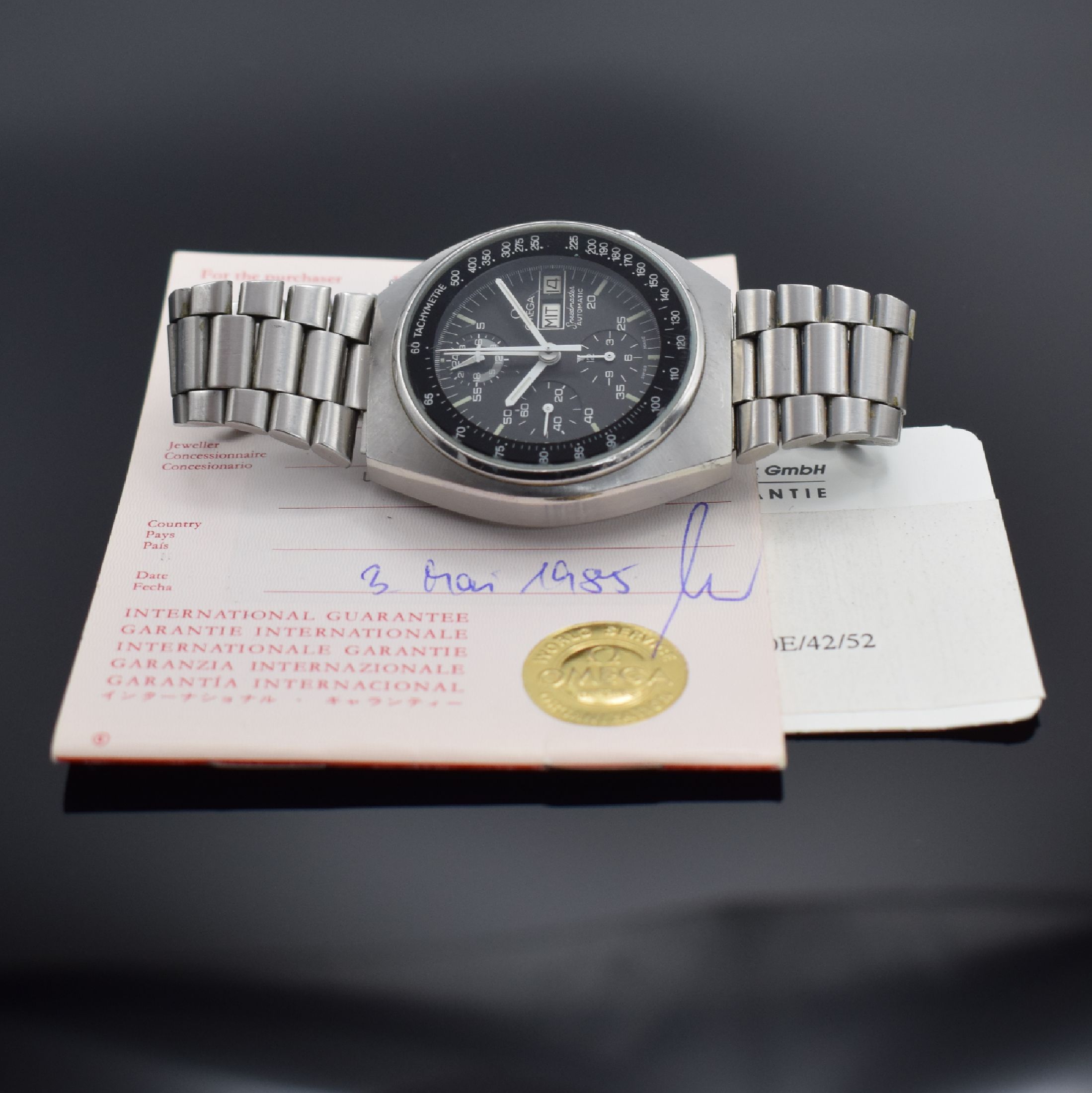 Detail h: OMEGA Speedmaster Armbandchronograph mit original Garantie-Booklet Referenz 176.0012, Automatik, Stahlgeh. inkl. orig. Gliederband m. Faltschließe, ...