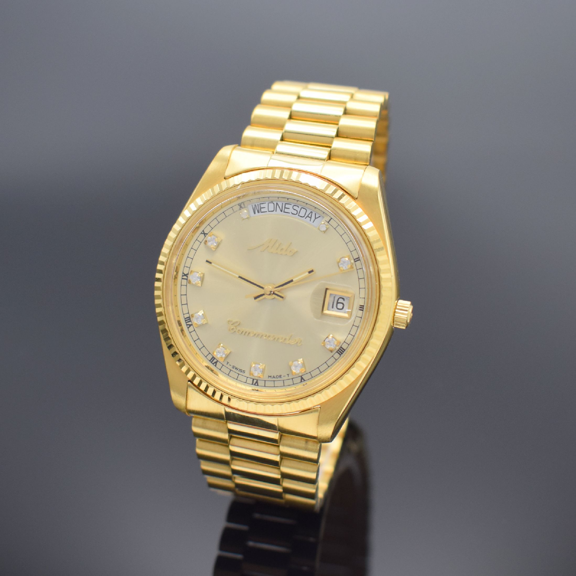 MIDO Commander Herrenarmbanduhr, Schweiz um 1990, Automatik, Ref. 8299, verg. Monocoque- Geh., verschr. Krone, orig. Gliederband m. Faltschl., gold. ...