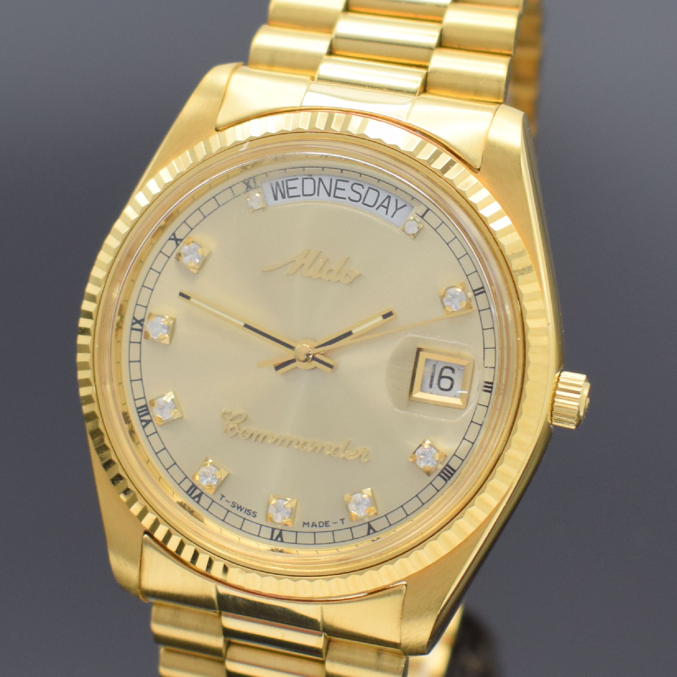 Detail a: MIDO Commander Herrenarmbanduhr, Schweiz um 1990, Automatik, Ref. 8299, verg. Monocoque- Geh., verschr. Krone, orig. Gliederband m. Faltschl., gold. ...