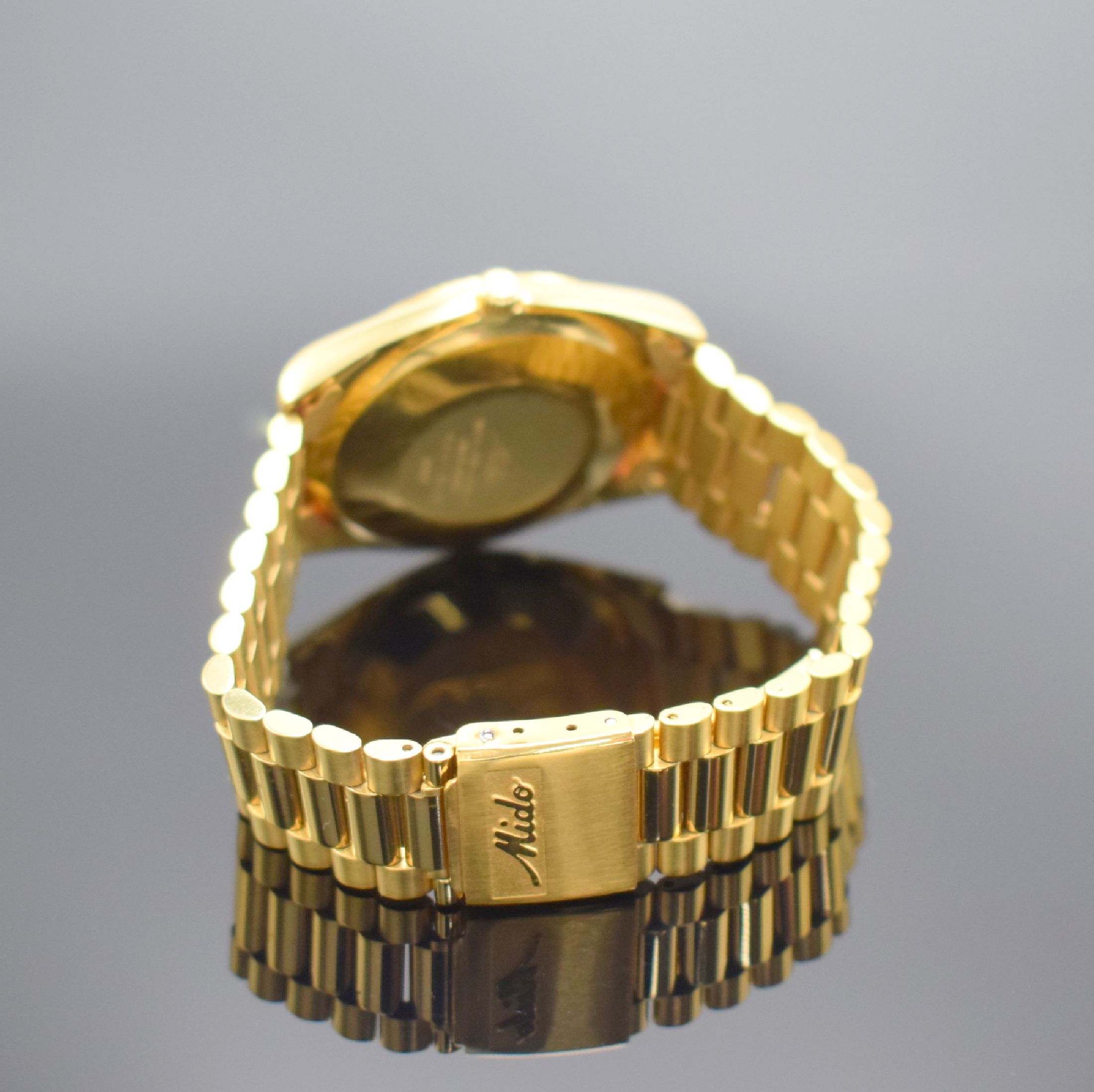Detail b: MIDO Commander Herrenarmbanduhr, Schweiz um 1990, Automatik, Ref. 8299, verg. Monocoque- Geh., verschr. Krone, orig. Gliederband m. Faltschl., gold. ...