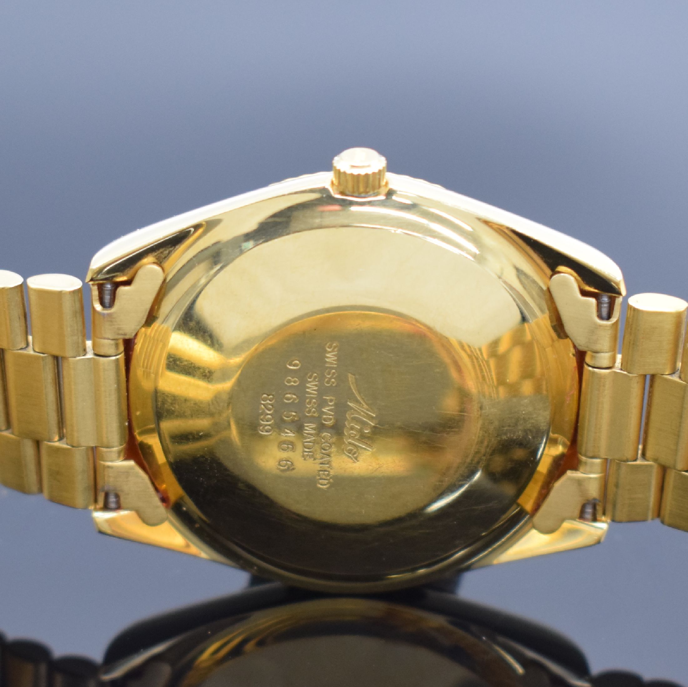 Detail d: MIDO Commander Herrenarmbanduhr, Schweiz um 1990, Automatik, Ref. 8299, verg. Monocoque- Geh., verschr. Krone, orig. Gliederband m. Faltschl., gold. ...
