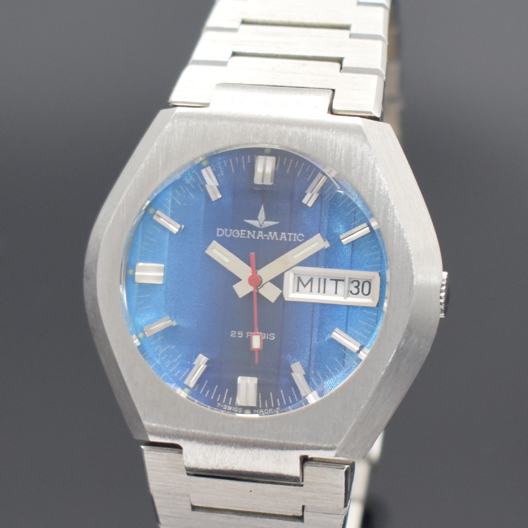 Detail a: DUGENA-MATIC seltene Armbanduhr mit Fume Zifferblatt, Schweiz um 1970, Automatik, Edelstahlgeh., Boden geschr., Gliederband. m. Faltschl., ...