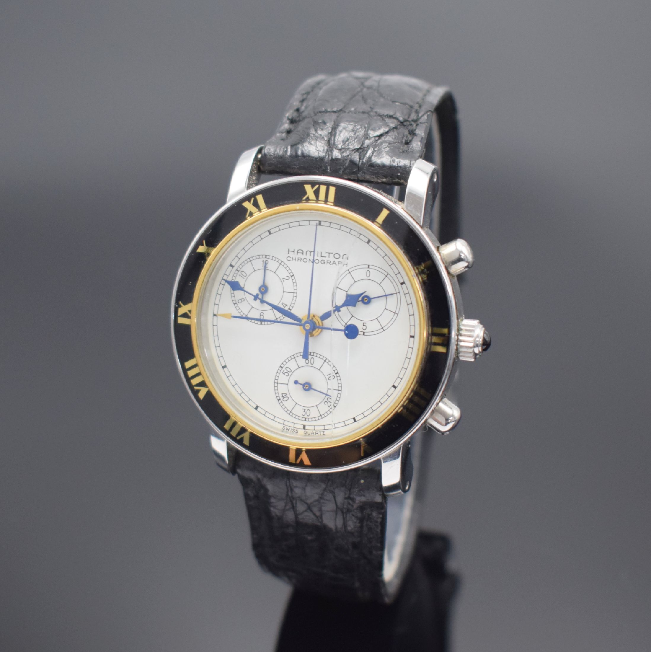 Detail c: 3 Herrenarmbanduhren mit Quarz-Werken, 1) Hamilton in Stahl mit Weltzeit-Anzeige, D. ca. 38 mm, EZ 2, 2) Hamilton Chronograph in Stahl, D. ca. 36 mm, ...