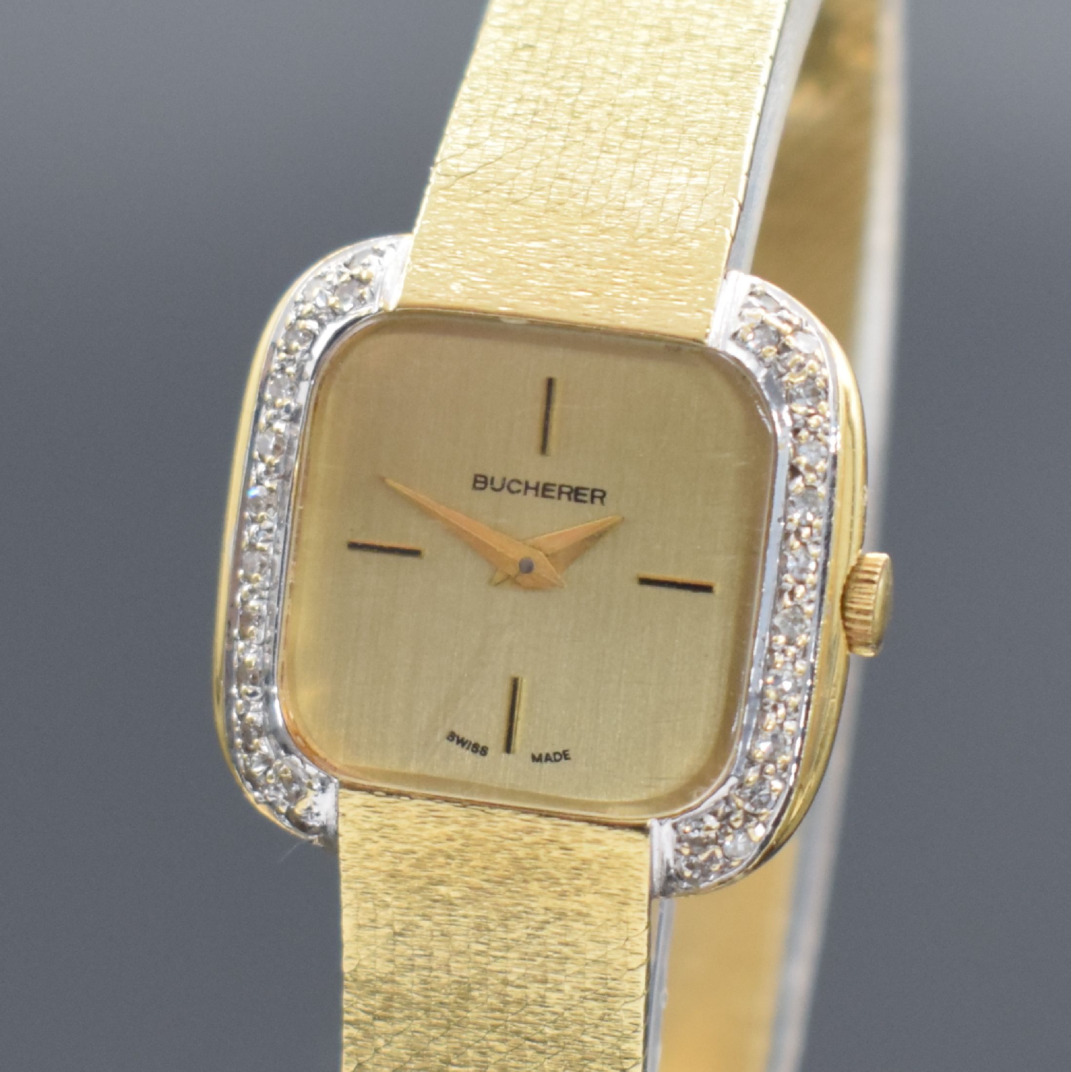 Detail a: BUCHERER Damenarmbanduhr in GG 750/000, Schweiz um 1965, Handaufzug, Boden aufgedr., Milanaiseband, Lünette mit Diamanten bes., gold. Zifferbl., ...