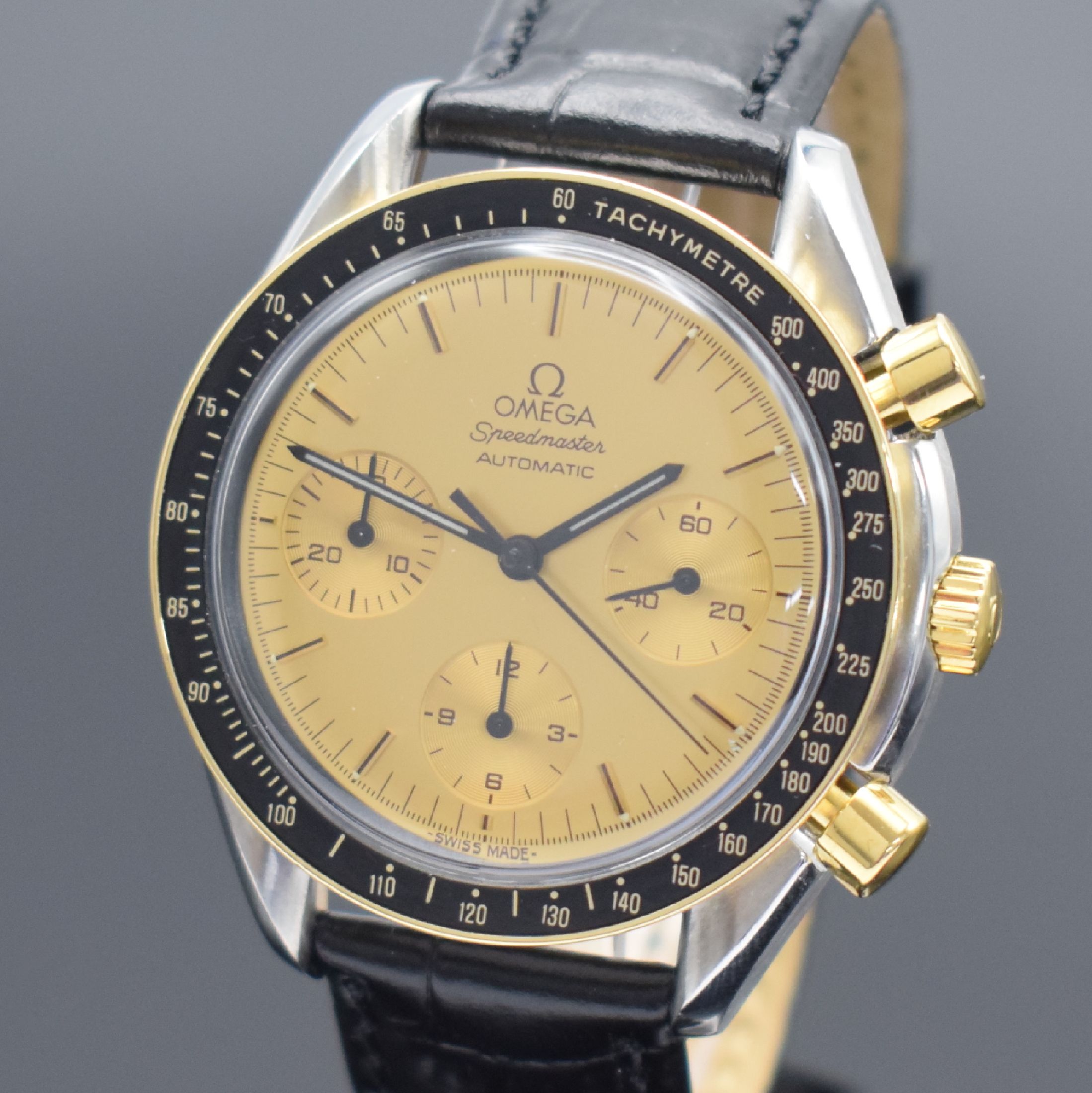 Detail a: OMEGA Speedmaster Herrenchronograph in Stahl/Gold Referenz 175.0032, Schweiz um 1990, Automatik, Lünette m. Tachymeterskala, goldfarb. Zifferbl. m. ...
