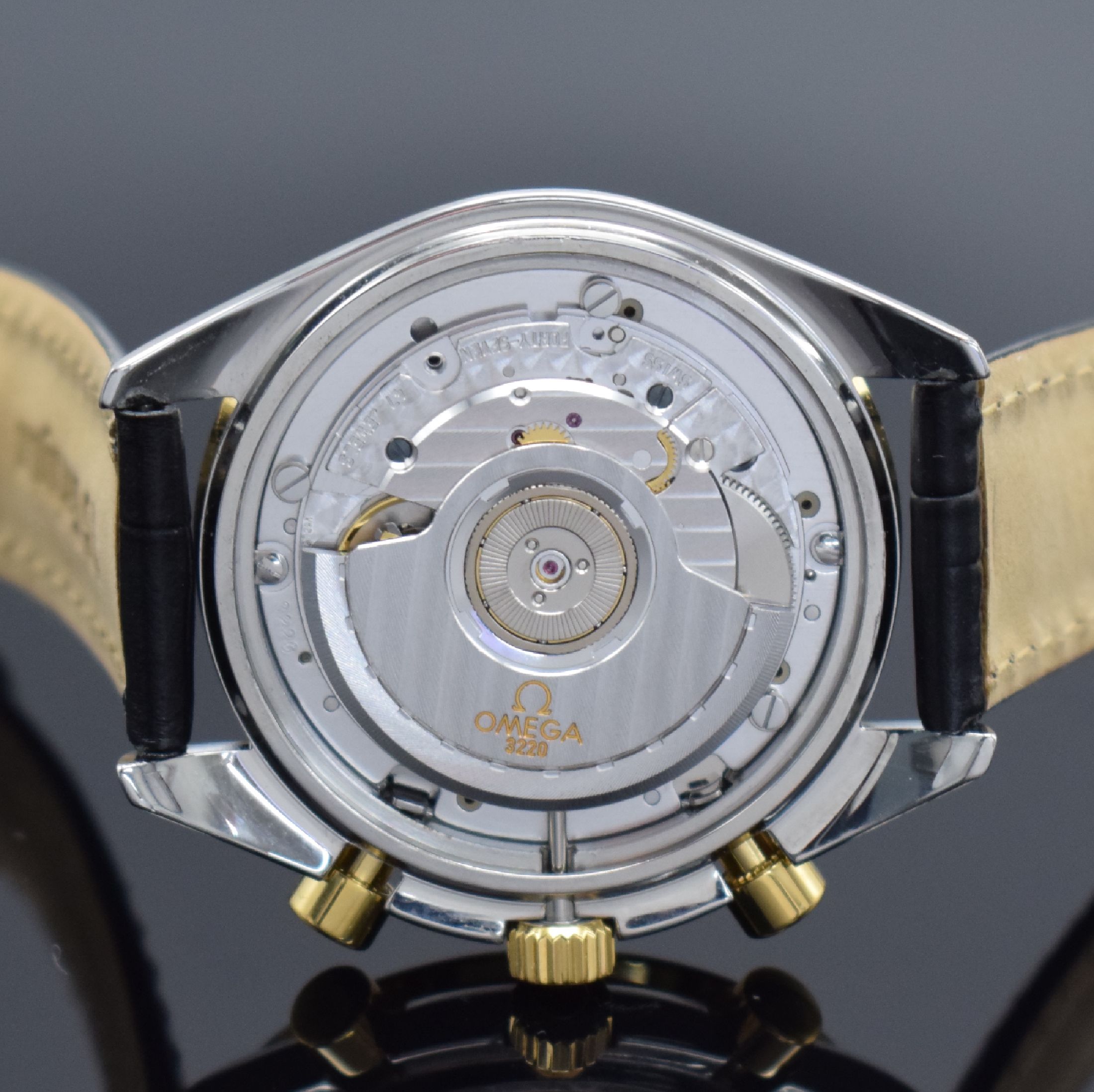 Detail e: OMEGA Speedmaster Herrenchronograph in Stahl/Gold Referenz 175.0032, Schweiz um 1990, Automatik, Lünette m. Tachymeterskala, goldfarb. Zifferbl. m. ...