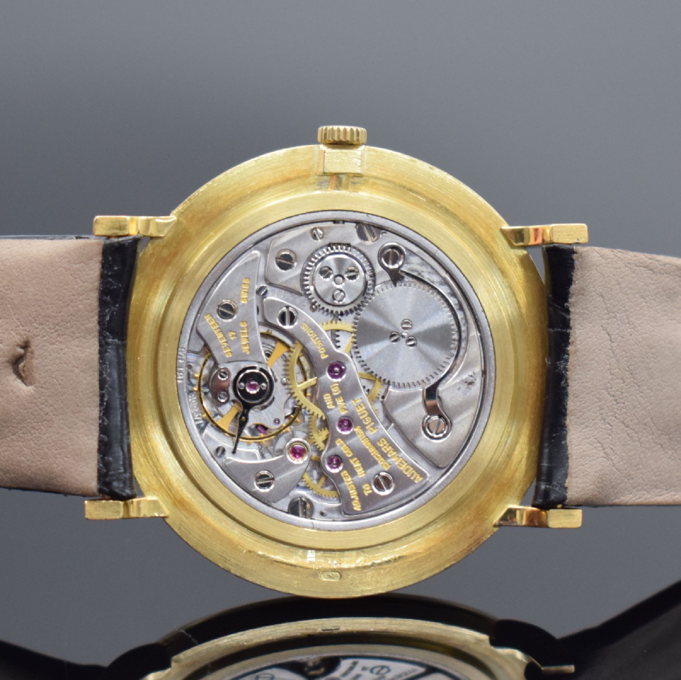 Detail e: AUDEMARS PIGUET feine Herrenarmbanduhr in GG 750/000 Referenz 5125BA, Schweiz um 1980, Handaufzug, Boden & Glasrand aufgedr., ultraflache ...