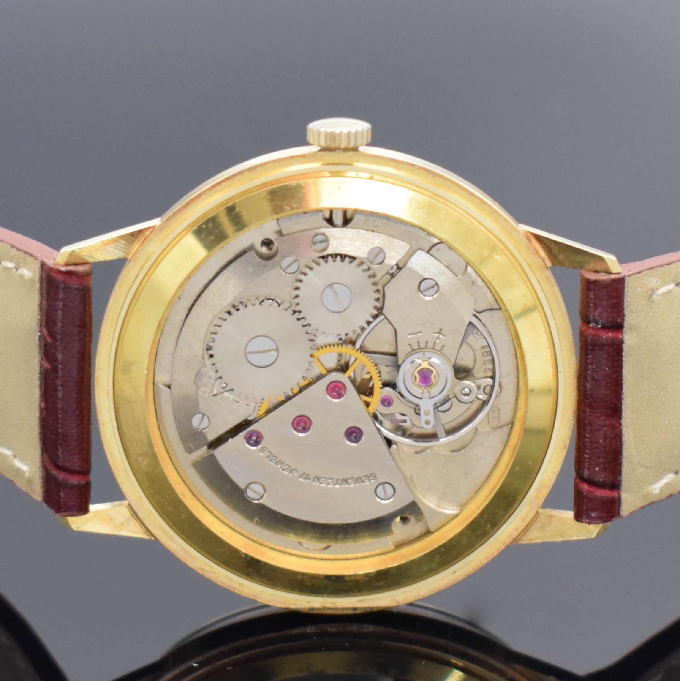 Detail d: EXQUISIT Armbanduhr in GG 585/000, Schweiz um 1965, Handaufzug, Boden aufgedr., silb. Zifferbl. m. gold. Std.-Ind. & Zeigern, Kal. ETA 2391, 17 St., ...