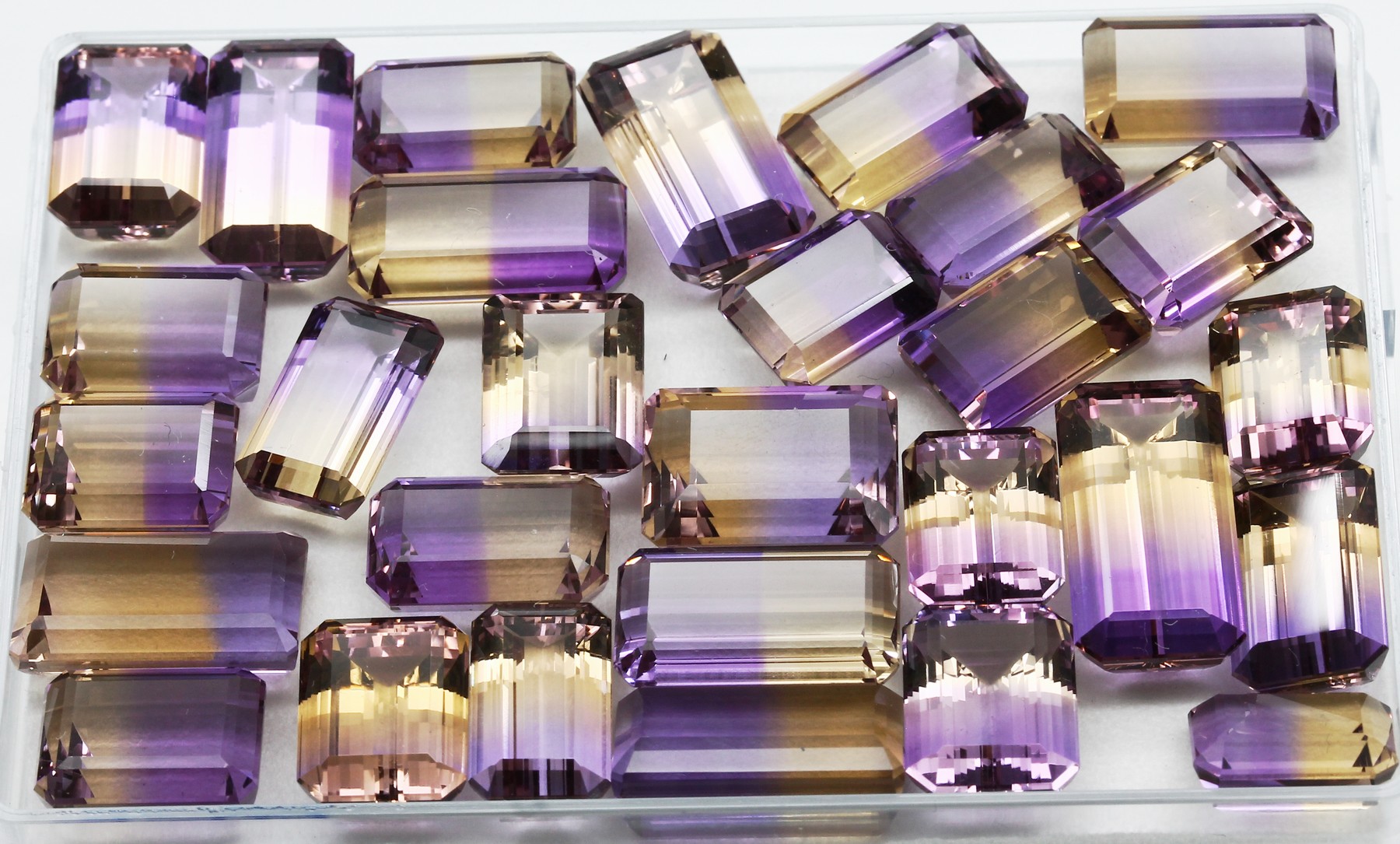 Detail a: Lot 30 lose Ametrine zus. ca. 216 ct, Treppenschliff in versch. Formen, Schleifarbeit aus Idar-Oberstein