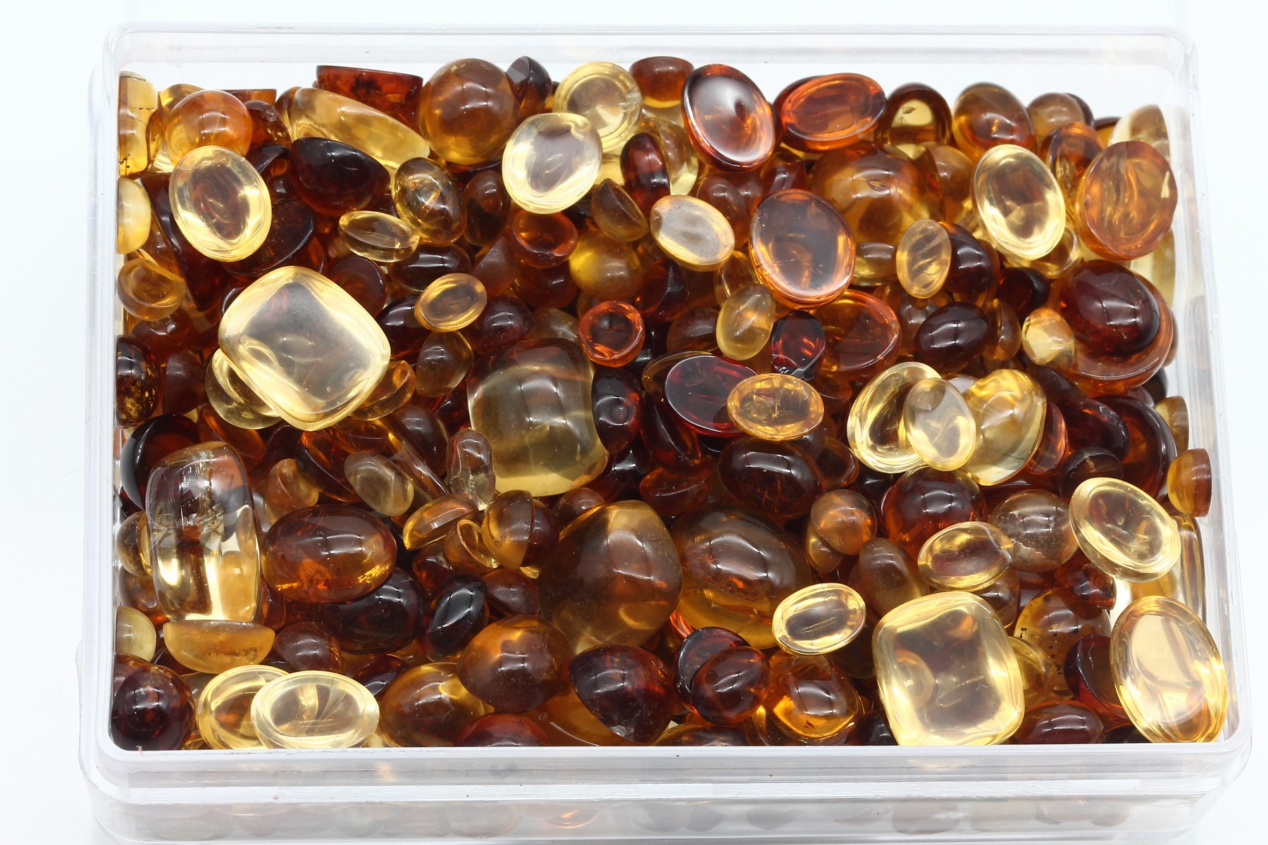 Detail a: Lot lose Citrine, ca. 627 ct, Cabochons in versch. Größen und Formen, versch. Farbintensitäten, Schleifarbeit aus Idar -Oberstein