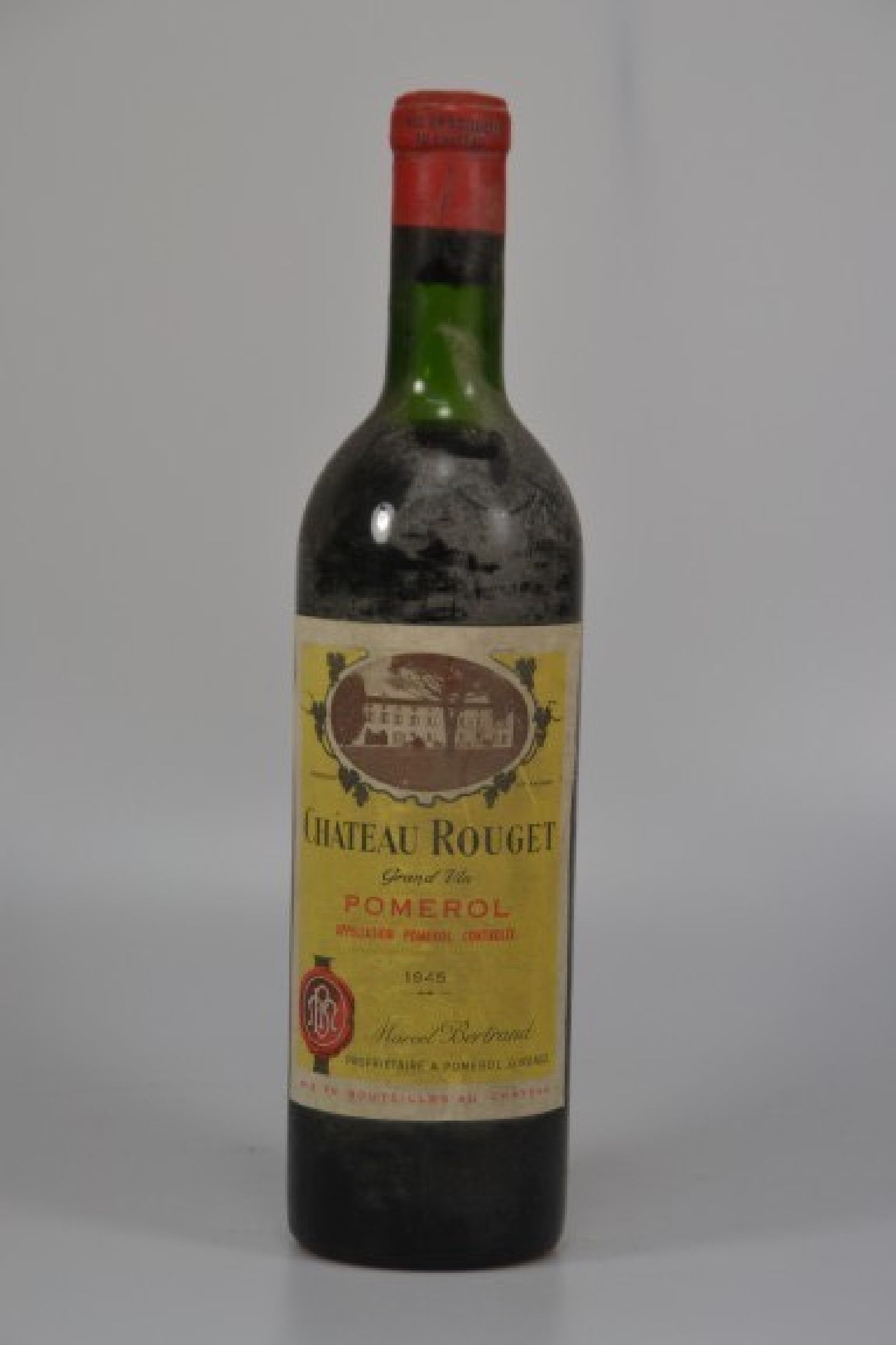 1 Flasche 1945 Chateau Rouget, Pomerol, Marcel Bertrand, 750ml, Mid SHoulder, beschmutzt