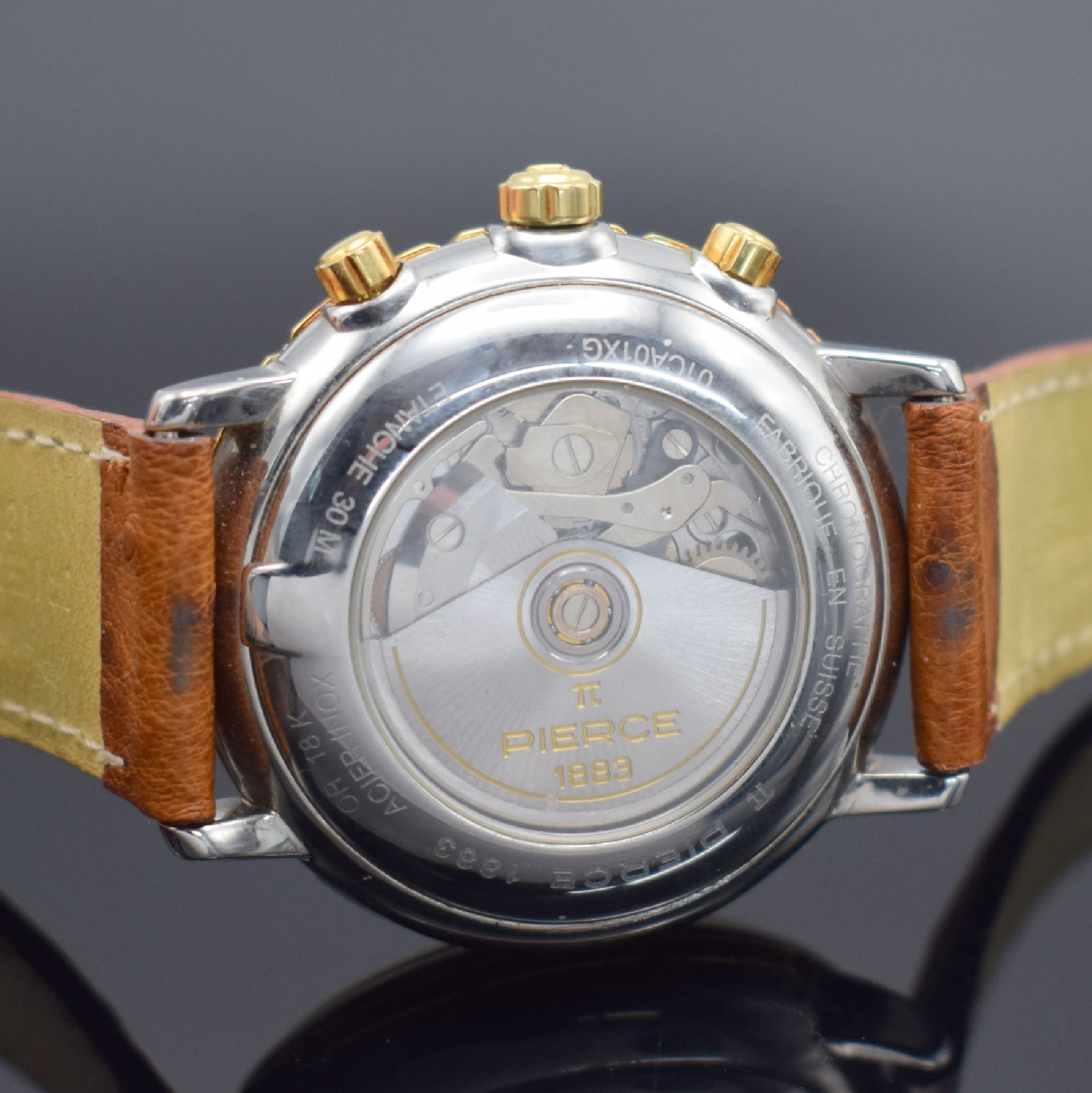 Detail d: PIERCE Herrenarmbanduhr mit Chronograph in Stahl/Gold, Schweiz um 2005, Automatik, beids. vergl. Geh., Boden aufgedr., Lünette in GG 750/000, orig. ...