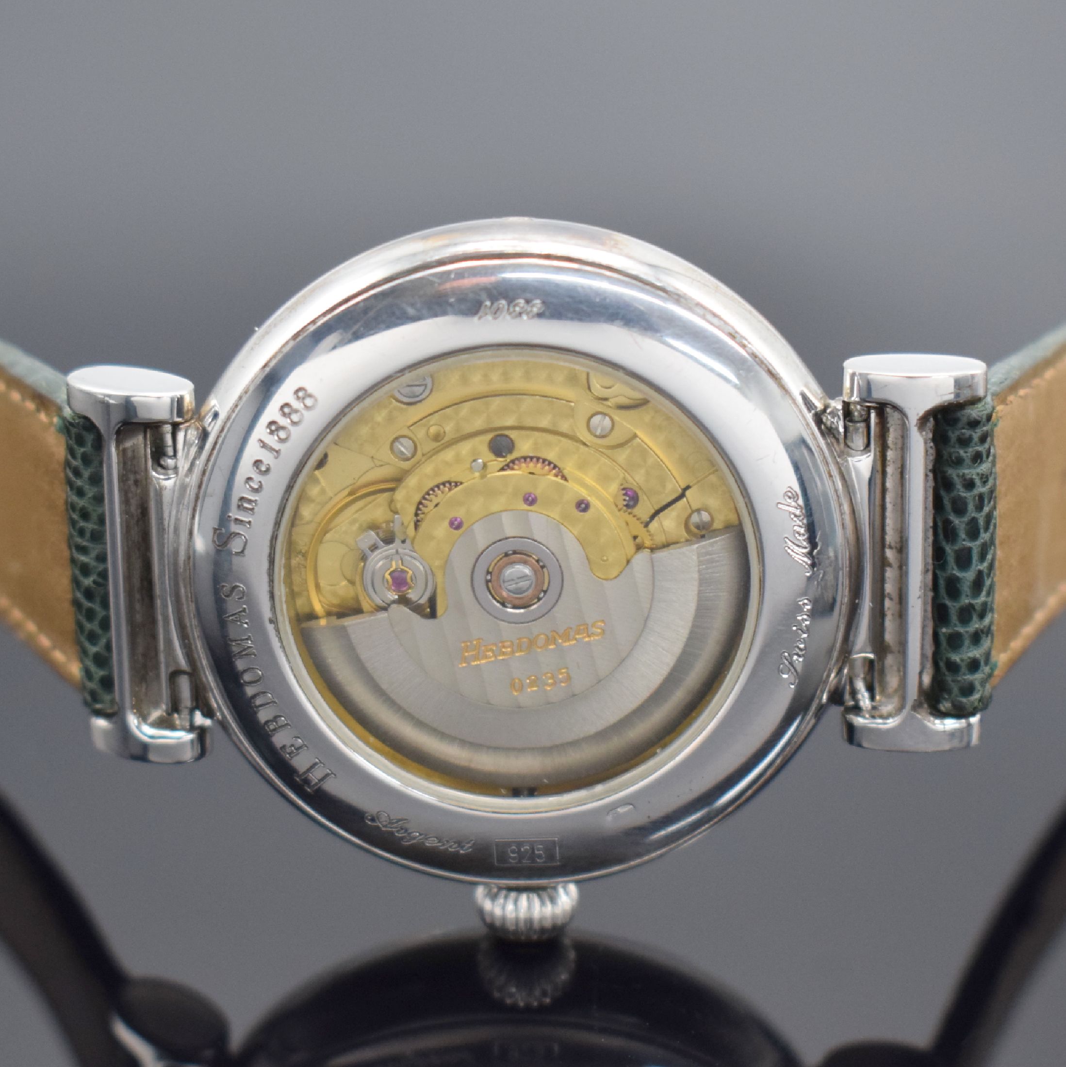 Detail d: HEBDOMAS Herrenarmbanduhr mit springender Stunde & 8 Tagewerk in 925er Silber, Schweiz um 1990, Automatik, Ref. 3301, beids. vergl. Geh. teils ...