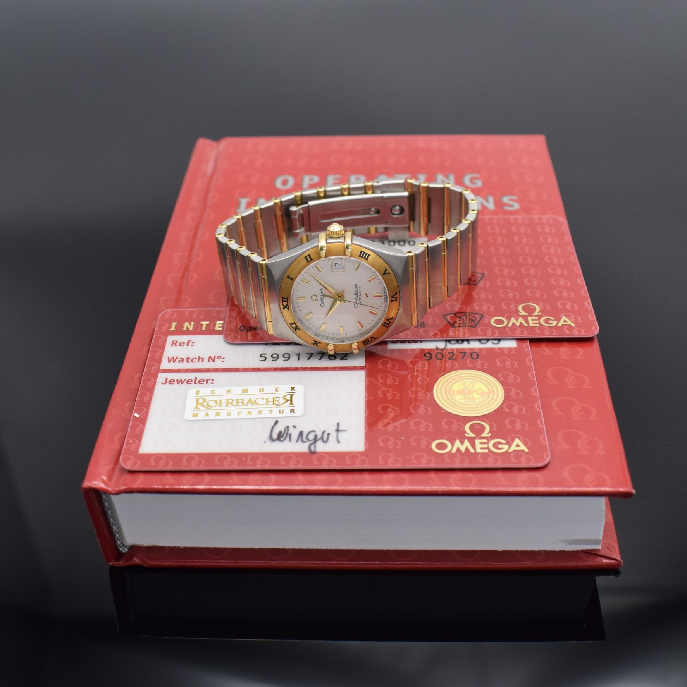 Detail e: OMEGA Constellation Damenarmbanduhr Referenz 12923000, Schweiz verk. 01/2009, Automatik, Edelstahl & Gold komb., Goldlünette m. röm. Zahlen, ...