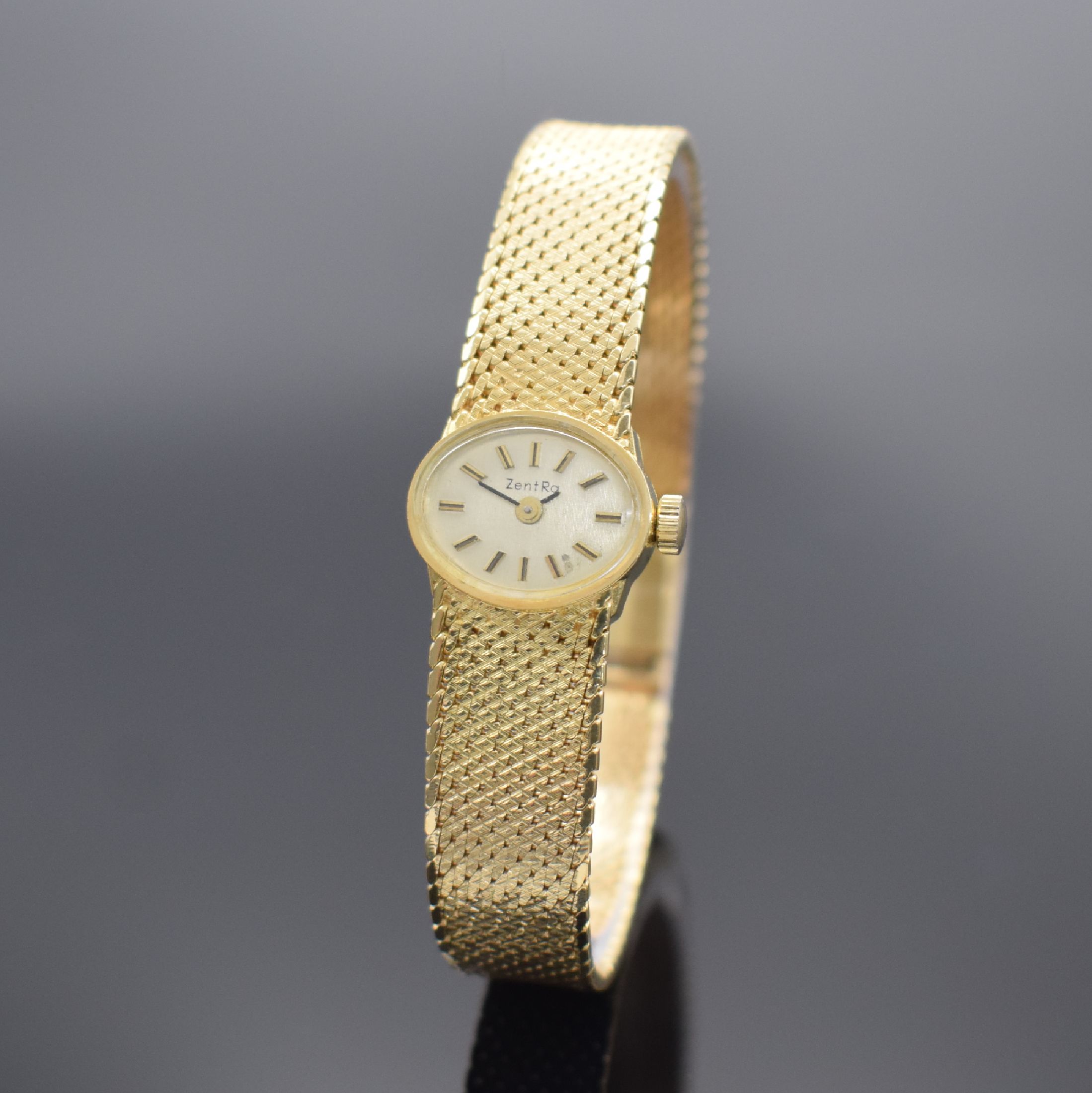 ZENTRA Damenarmbanduhr in GG 585/000, Handaufzug, Schweiz um 1965, Boden aufgedr., silb. Zifferbl. m. aufgel. Indizes altersbed. fl., Anz. v. Std. & ...