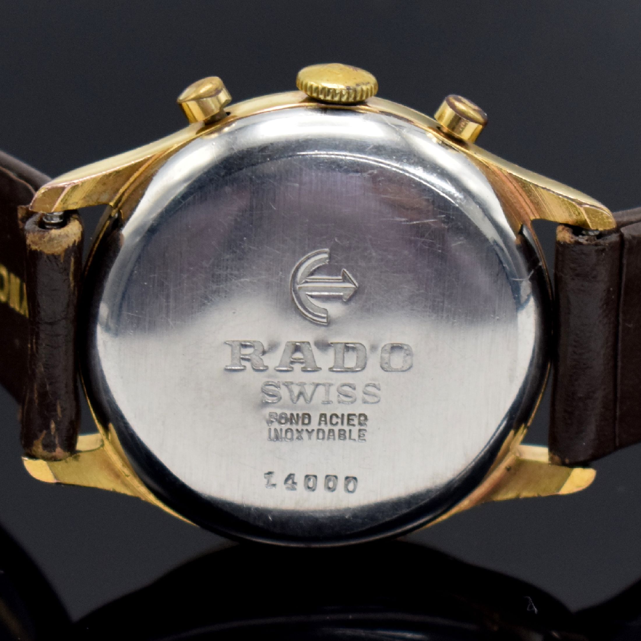 Detail e: RADO Herrenarmbanduhr mit Chronograph, Schweiz um 1960, Handaufzug, verg. Gehäuse, Stahlboden & Glasrand aufgedr., silb. Zifferbl. m. aufges. gold. ...